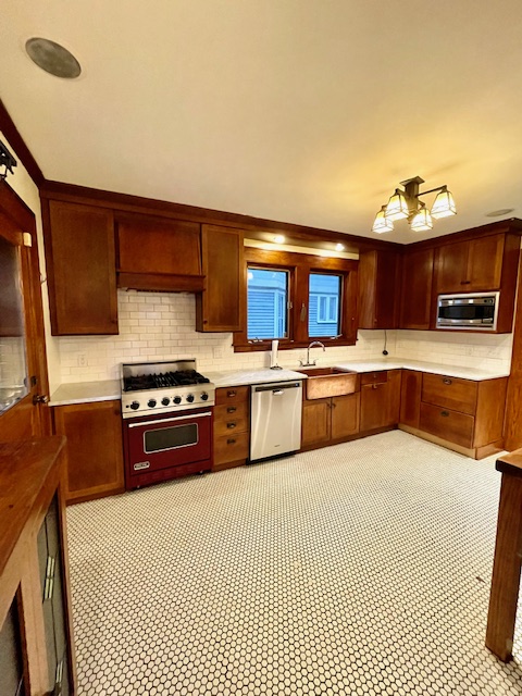 340 Marlborough Road Brooklyn, NY 11226 - Photo 10 of 27 a kitchen with stainless steel appliances a sink and a stove
