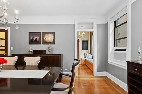 a kitchen with stainless steel appliances granite countertop a refrigerator and a stove