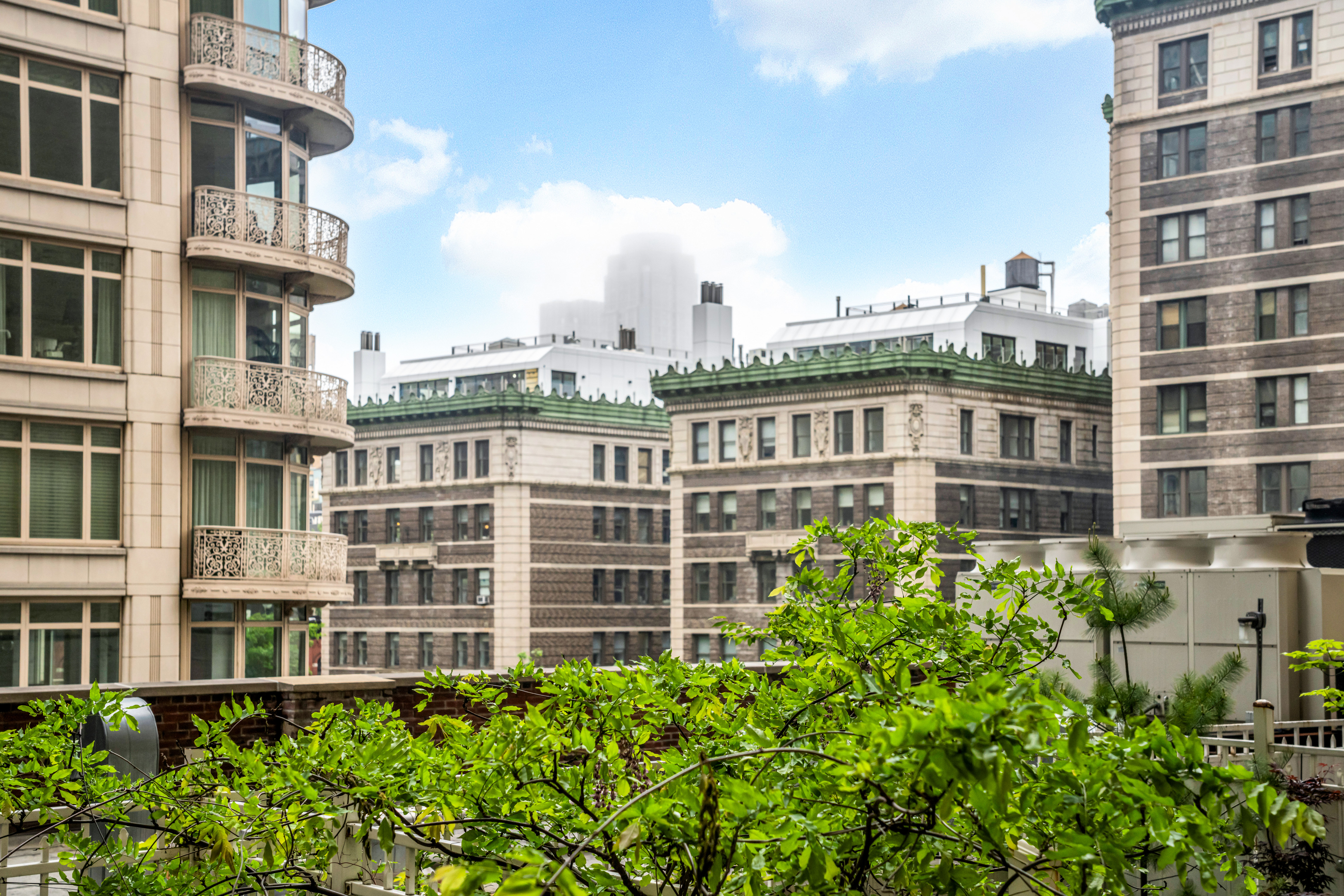 2166 Broadway, Unit 5C Manhattan, NY 10024 - Photo 10 of 11 a view of a building with a yard