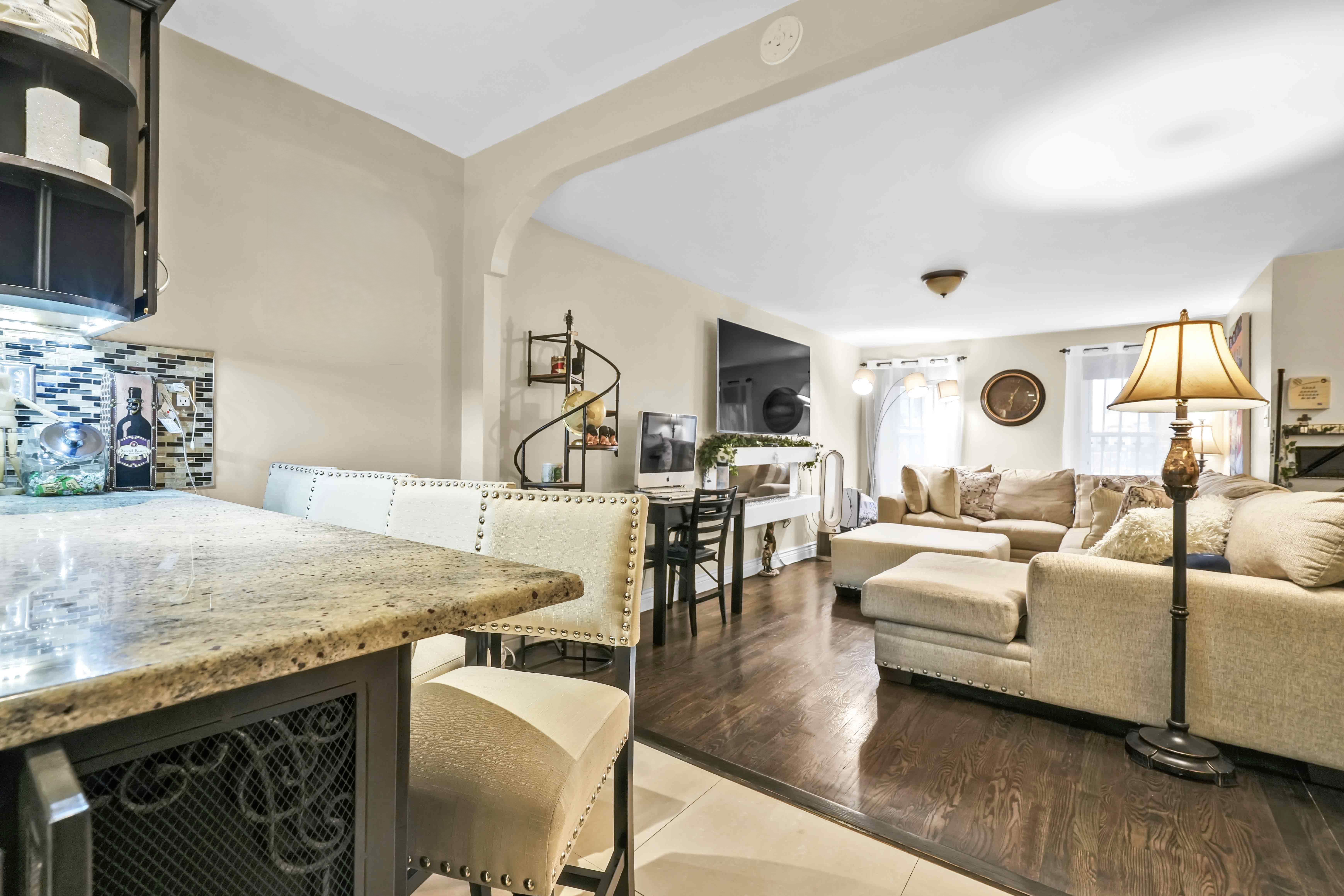519 Monroe Street Brooklyn, NY 11221 - Photo 31 of 55 a living room with furniture and a flat screen tv