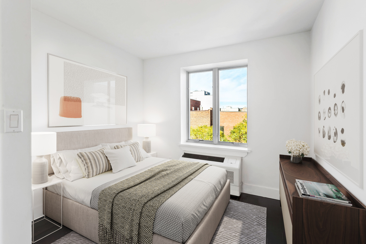 120 Boerum Street, Unit 2B Brooklyn, NY 11206 - Photo 2 of 6 a bedroom with a bed and a window