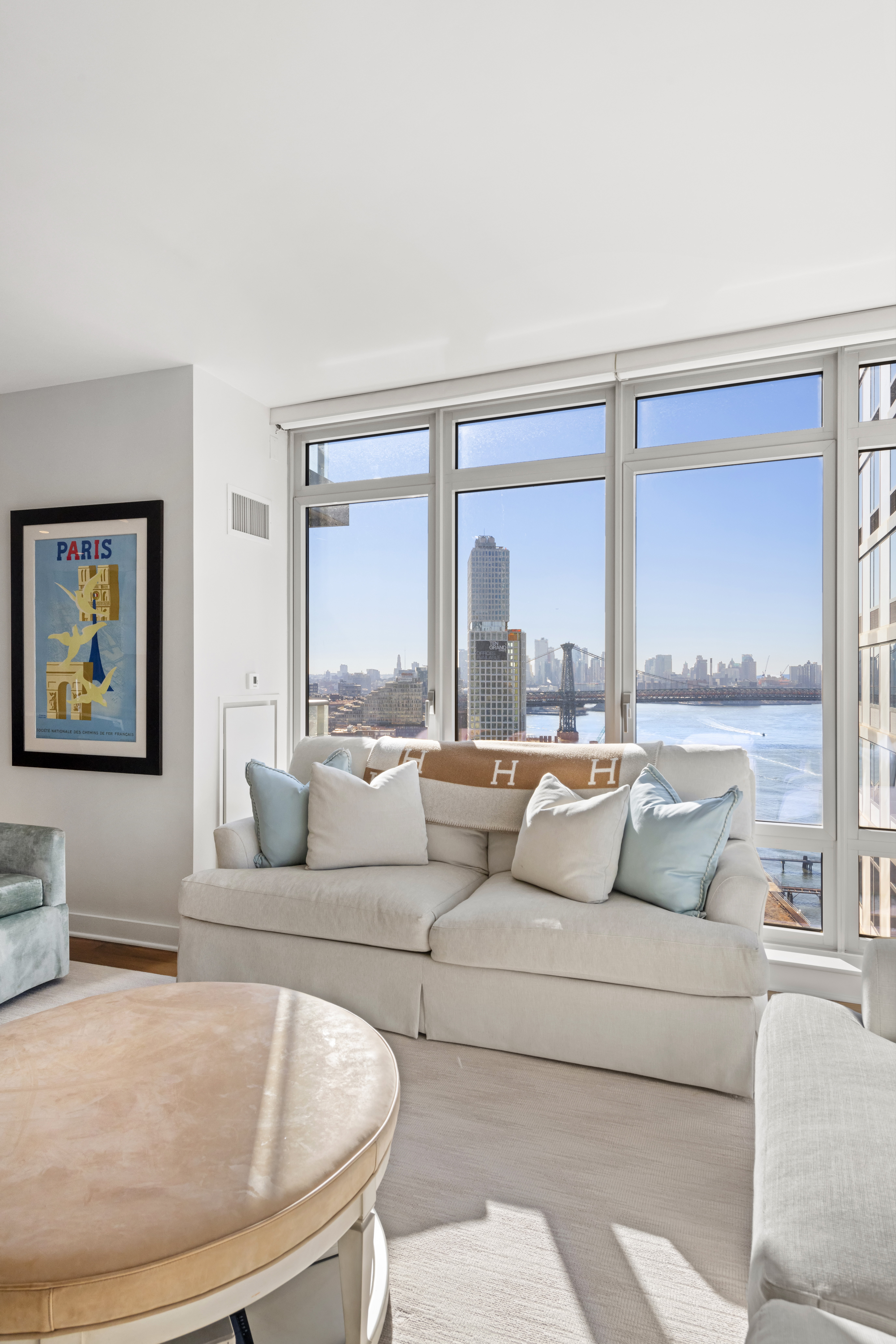 2 Northside Piers, Unit 17A Brooklyn, NY 11249 - Photo 8 of 21 a living room with couches and a large window with outer view
