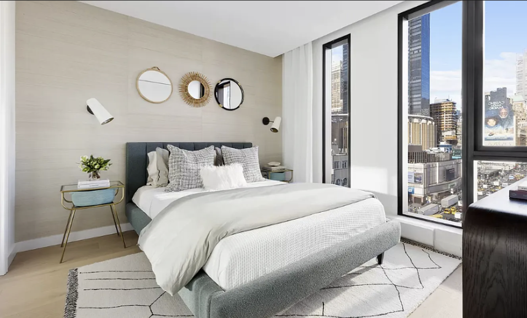 a bedroom with a large bed and a window