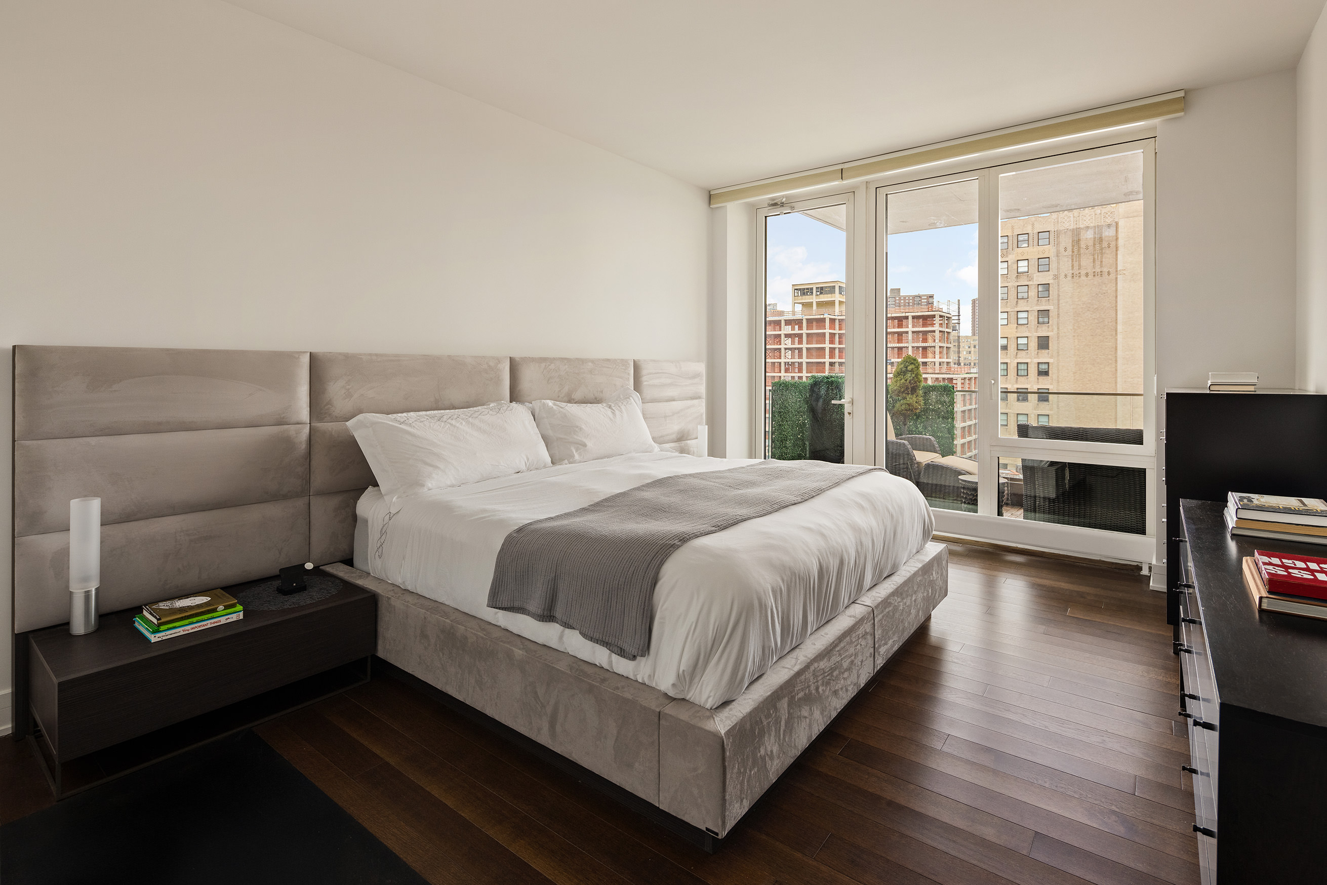 5 Franklin Place, Unit 14A Manhattan, NY 10013 - Photo 7 of 23 a large bedroom with a bed and wooden floor
