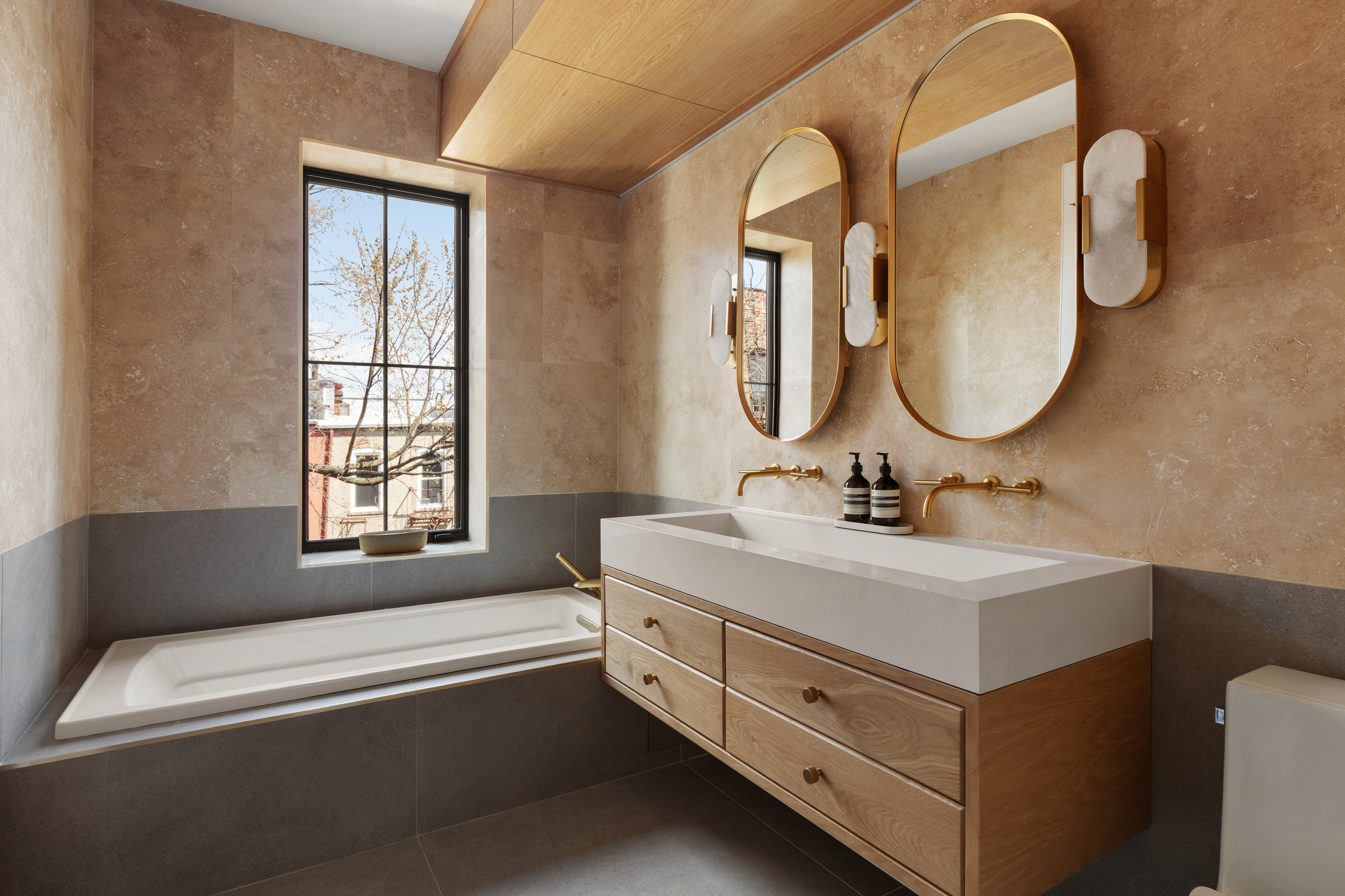 357 Eastern Parkway Brooklyn, NY 11216 - Photo 9 of 15 a bathroom with a double vanity sink and a bathtub