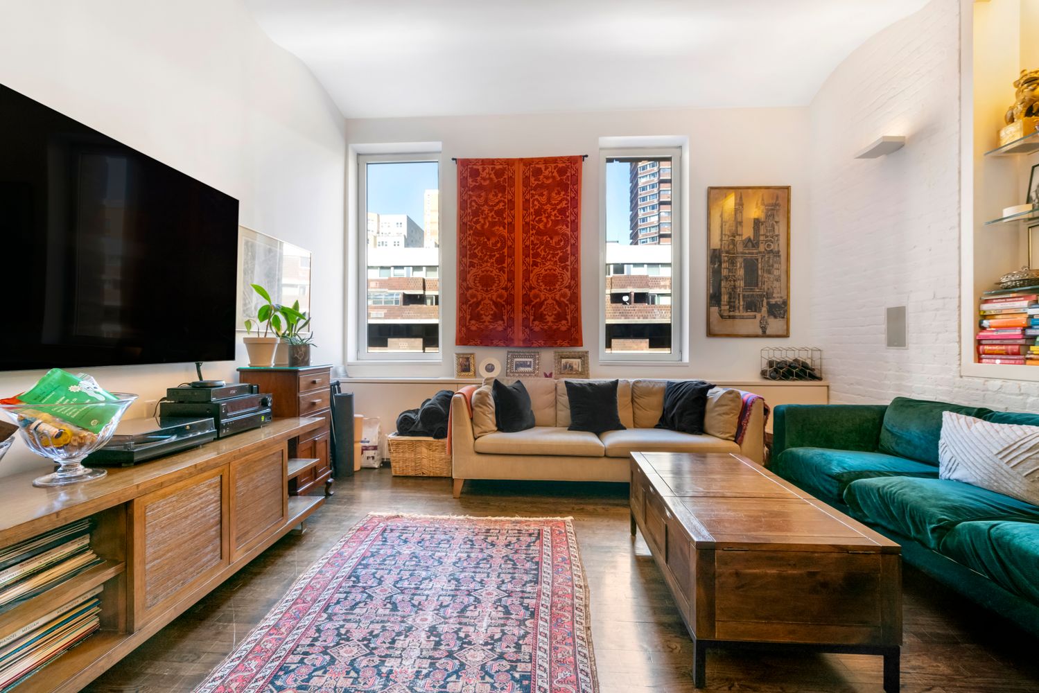 a living room with furniture and a flat screen tv