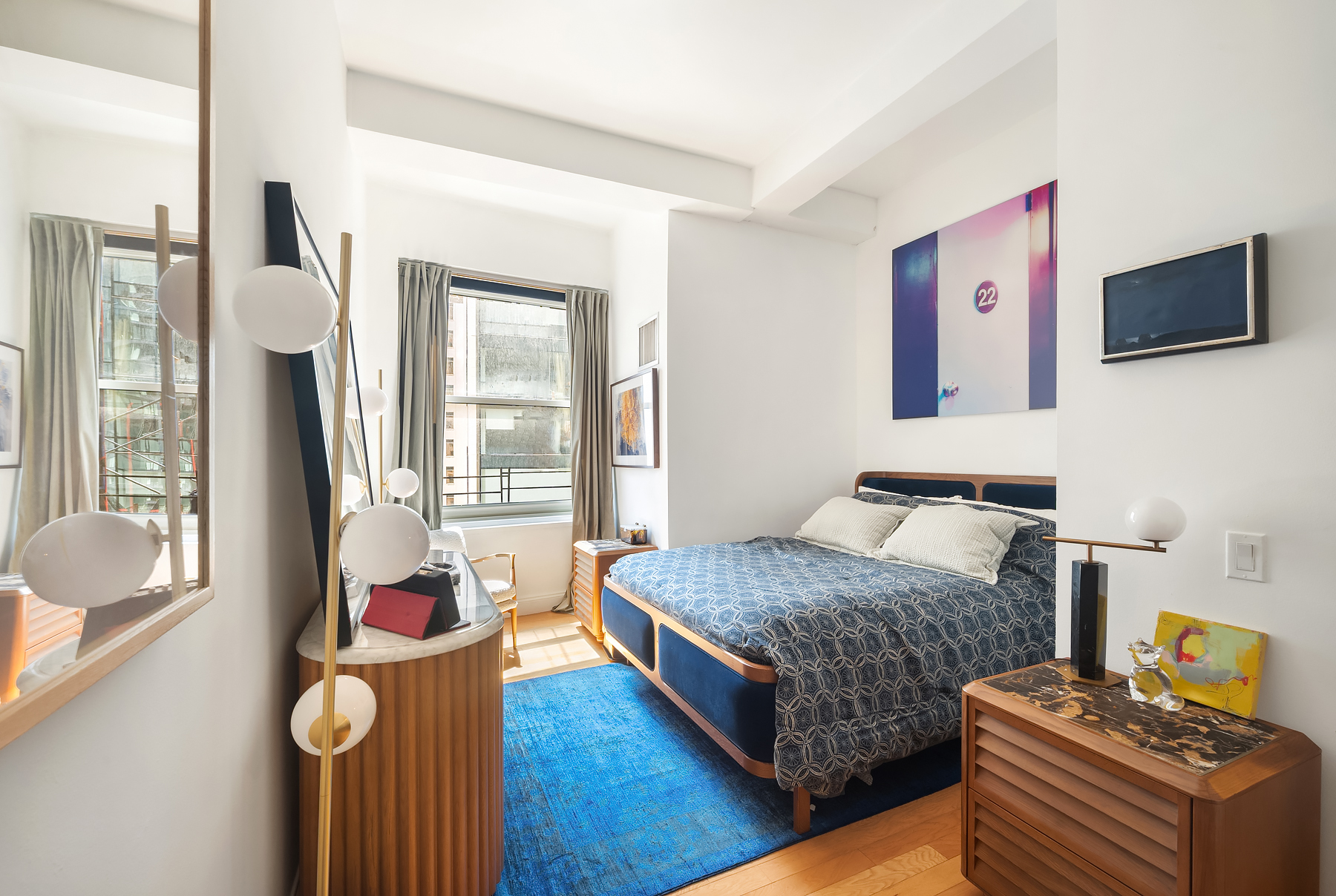 88 Greenwich Street, Unit 1605 Manhattan, NY 10006 - Photo 3 of 32 a bedroom with a bed and flat screen tv