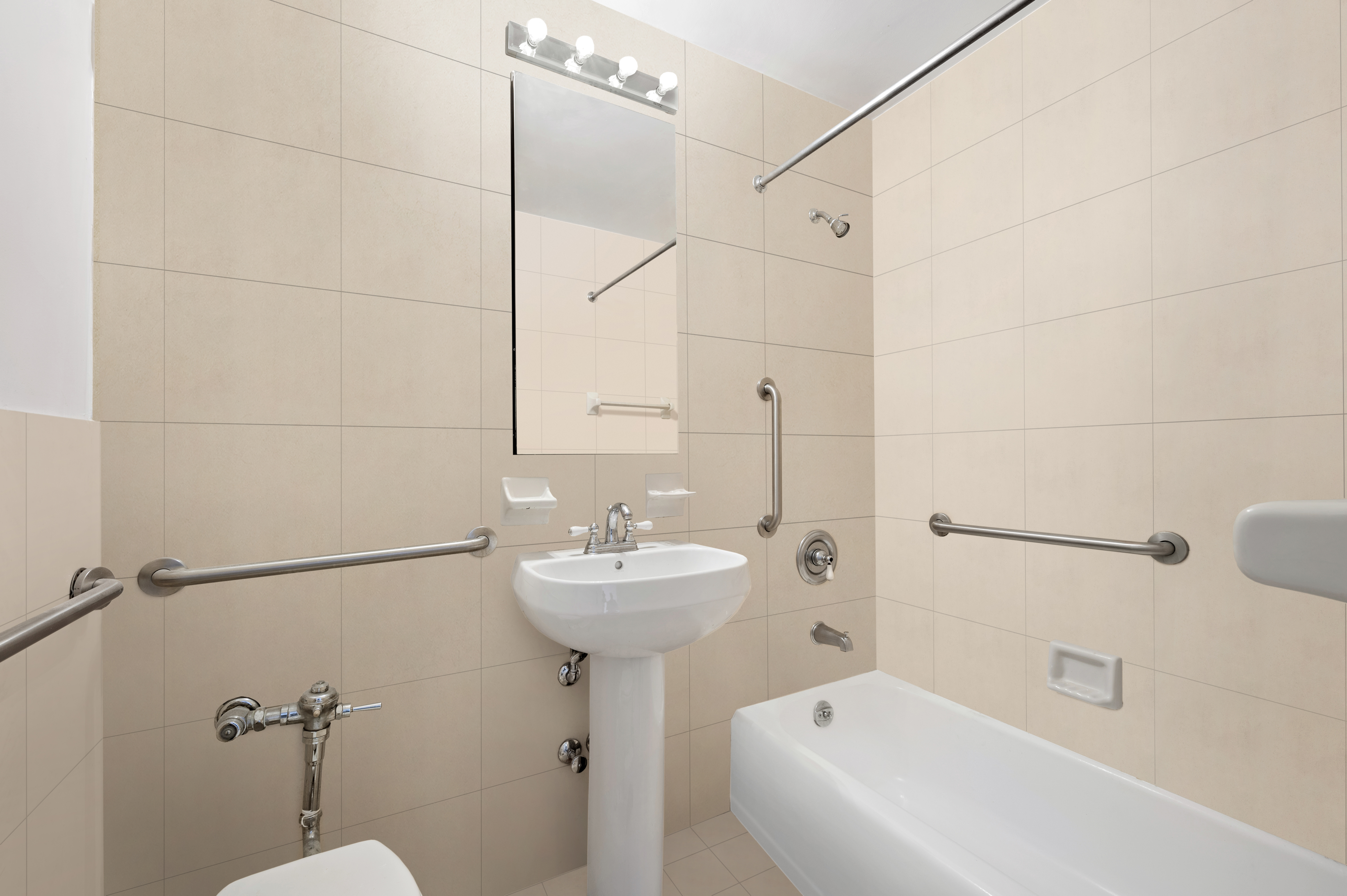 61 Jane Street, Unit 5A Manhattan, NY 10014 - Photo 8 of 13 a bathroom with a sink a toilet and shower