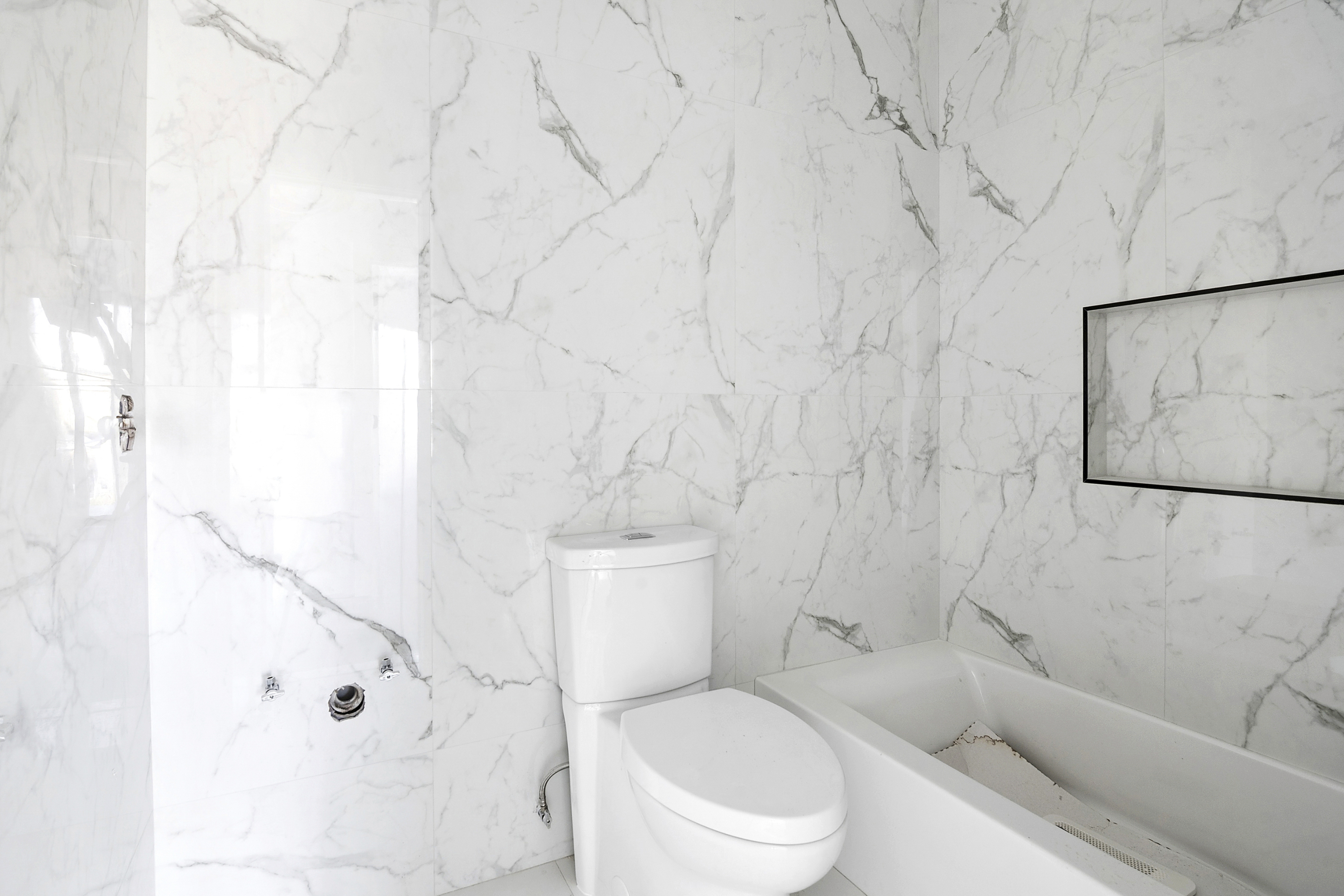 3624 Avenue P Brooklyn, NY 11234 - Photo 17 of 26 a white toilet sitting next to a bathroom sink