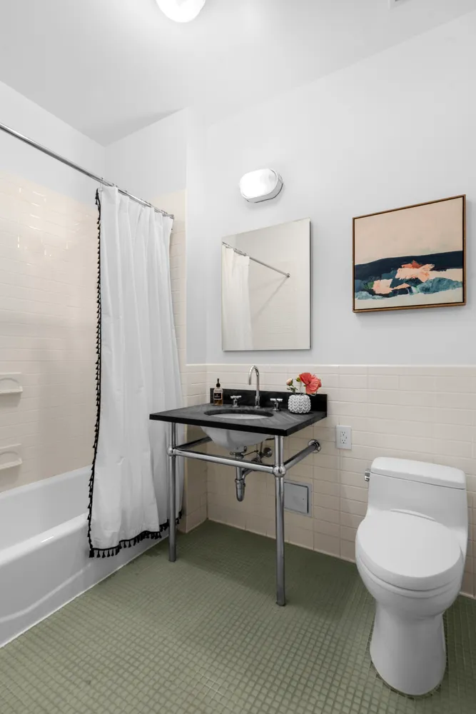 a bedroom with bed and a window