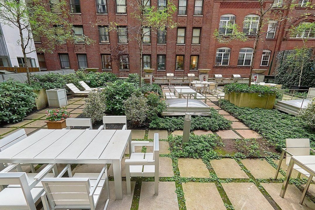 99 John Street, Unit 1711 Manhattan, NY 10038 - Photo 10 of 14 a view of a patio with a table and chairs