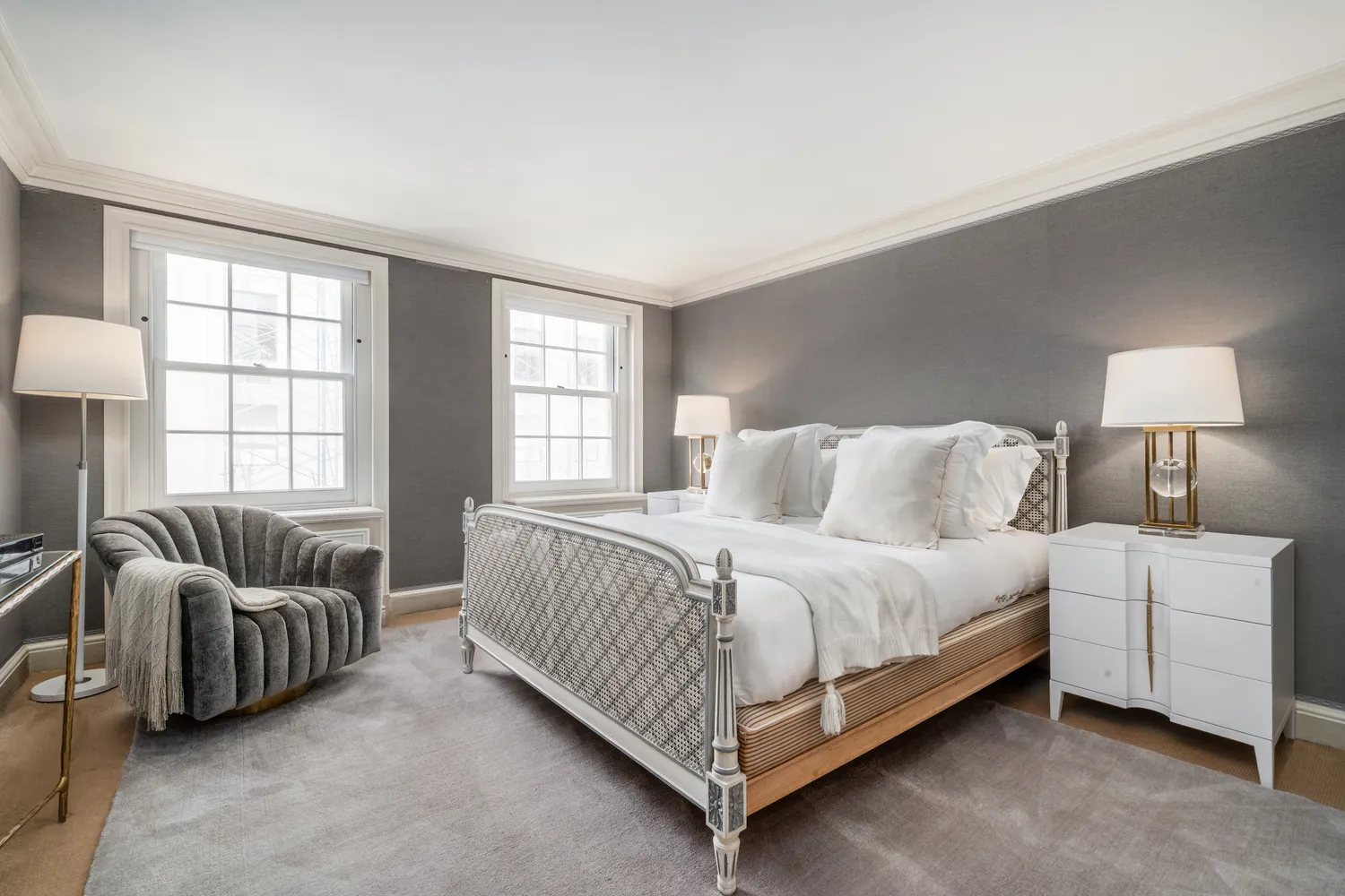 a bedroom with a bed and a night stand