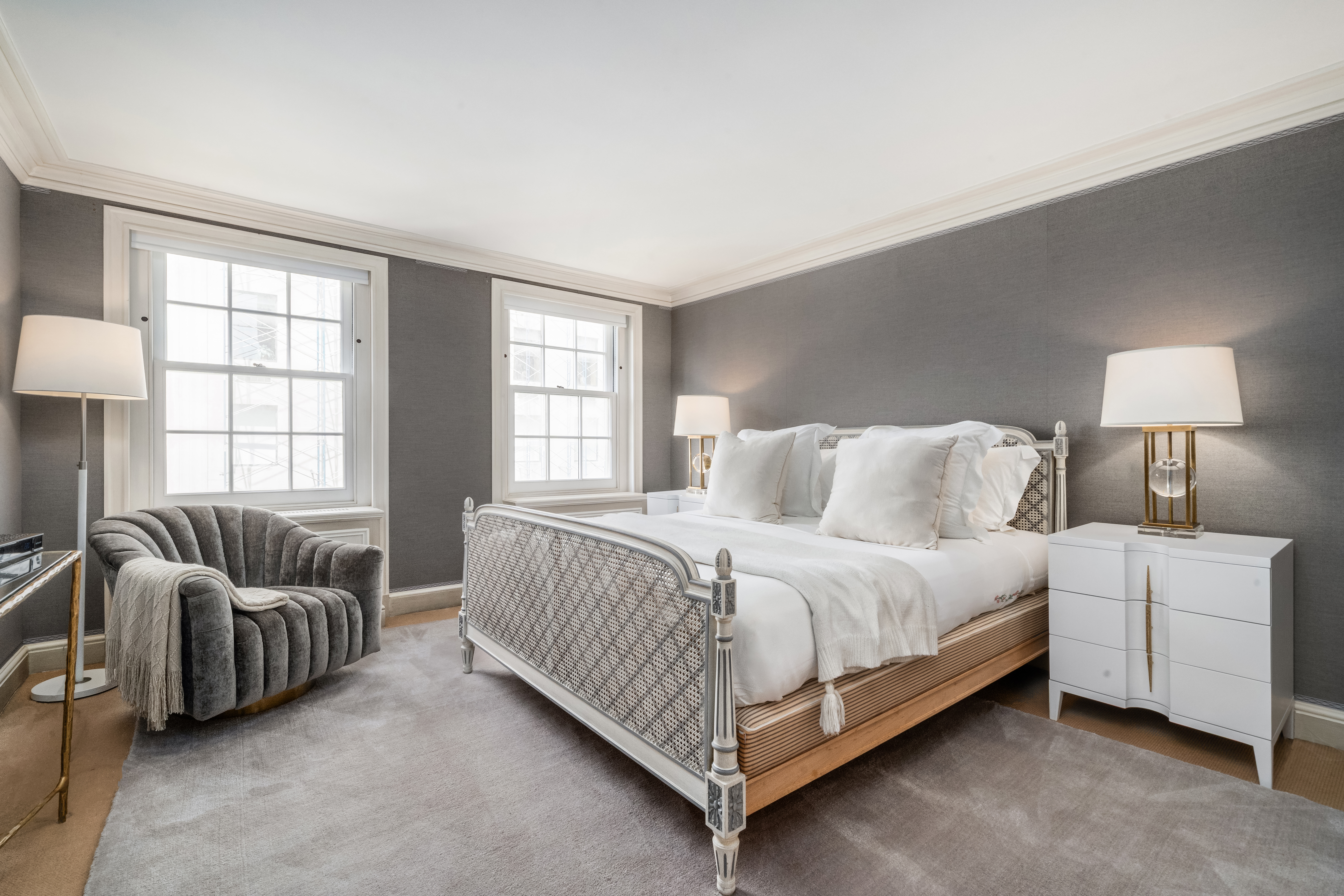 46 East 71st Street Manhattan, NY 10021 - Photo 21 of 27 a bedroom with bed couch and window