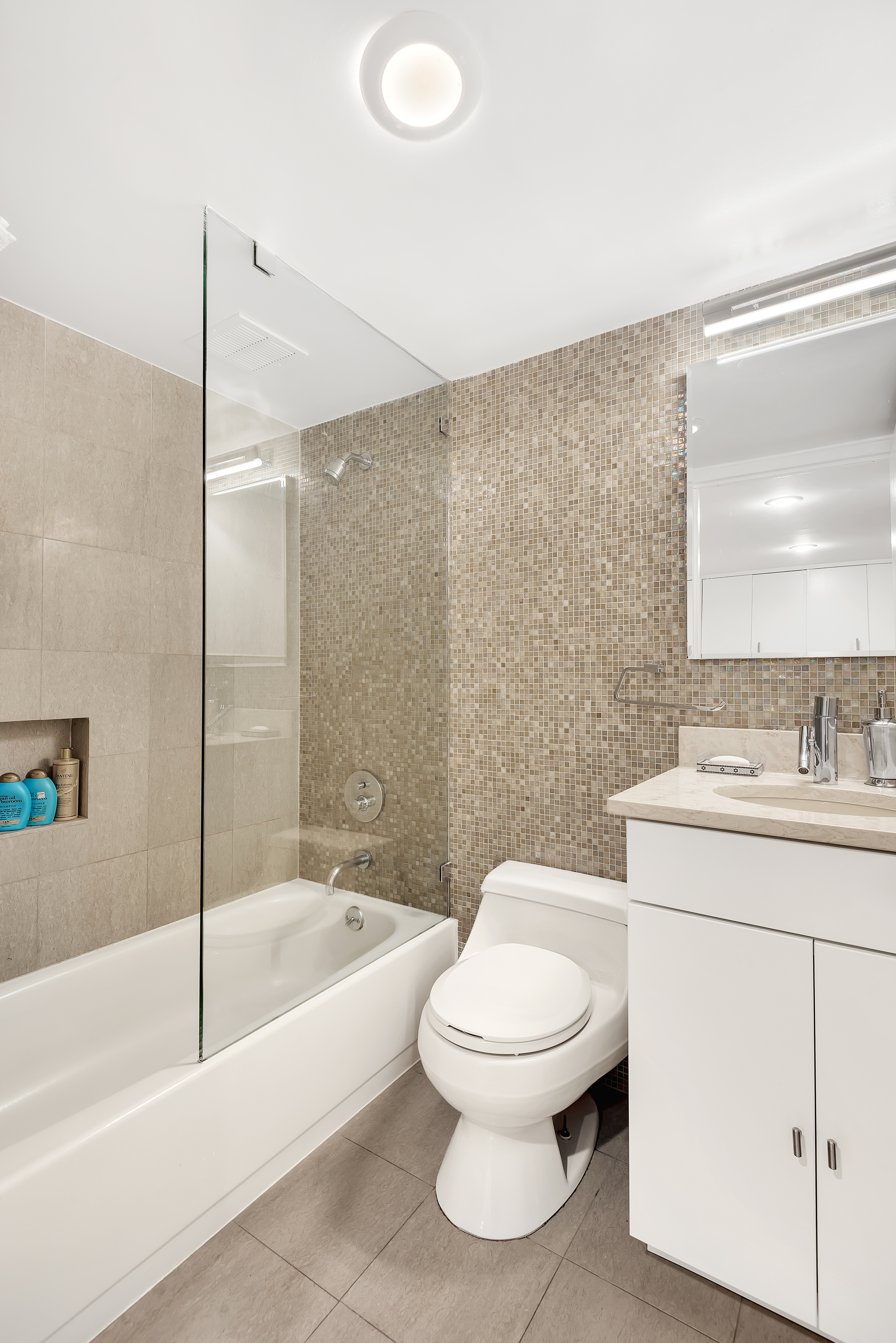 372 5th Avenue, Unit 3M Manhattan, NY 10018 - Photo 9 of 14 a bathroom with a toilet and a bathtub