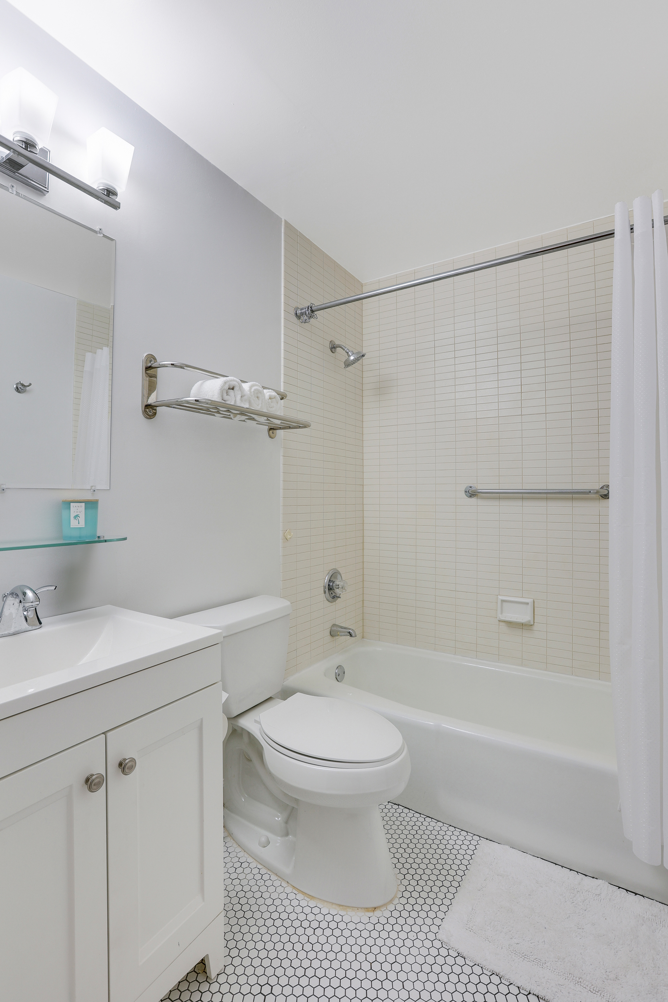 1255 5th Avenue, Unit 5B Manhattan, NY 10029 - Photo 10 of 12 a bathroom with a toilet sink and shower