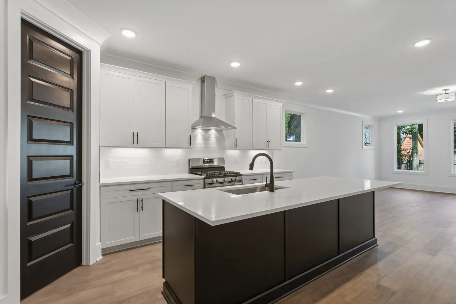 a bathroom with double vanity sink and a mirror