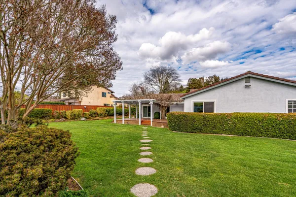 a house view with a garden space