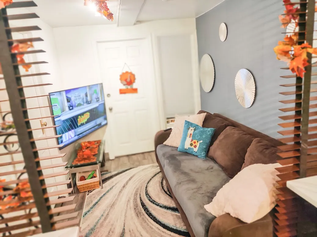 a white toilet sitting next to a shower curtain