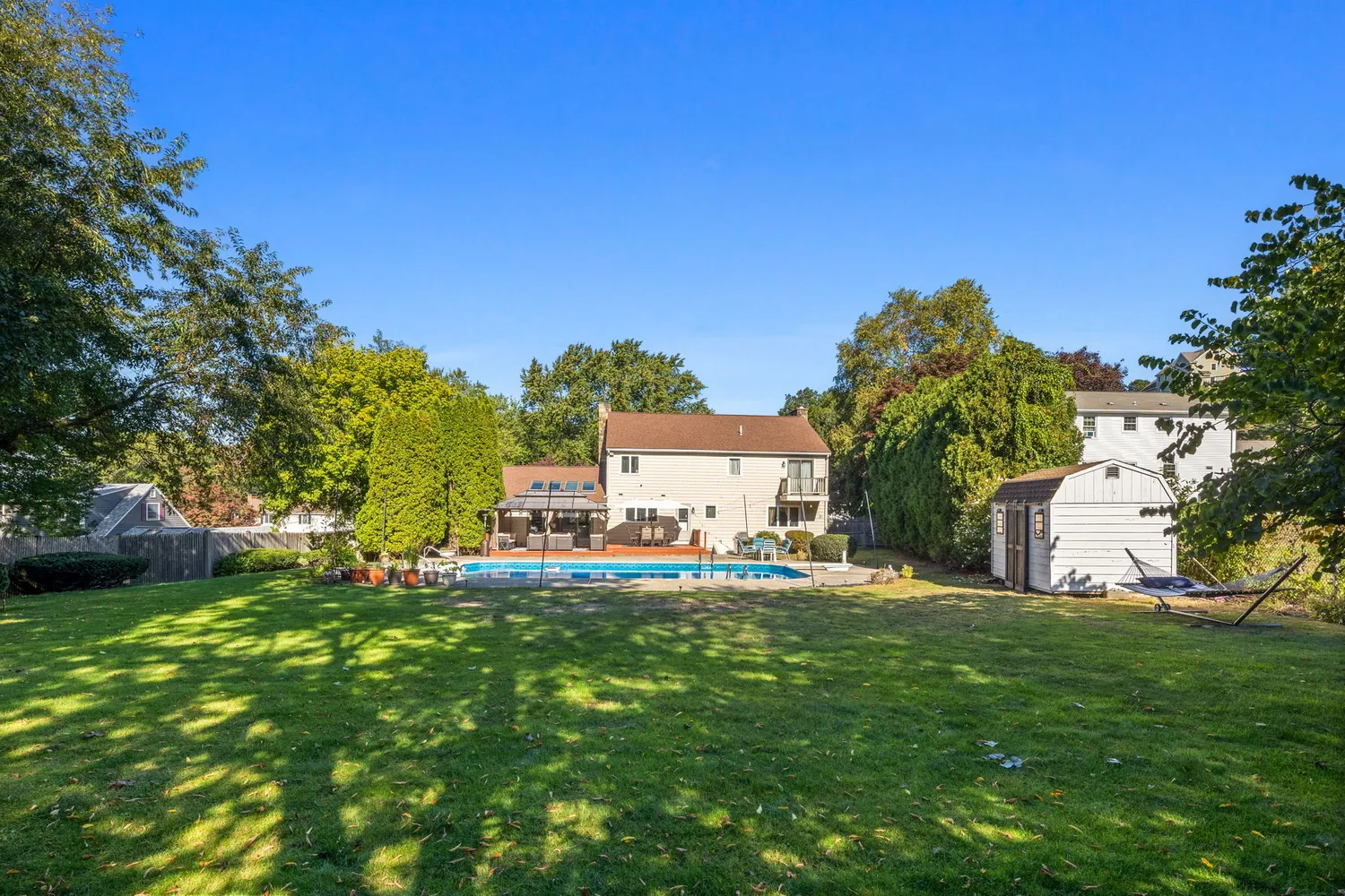 a house view with a sitting space and garden
