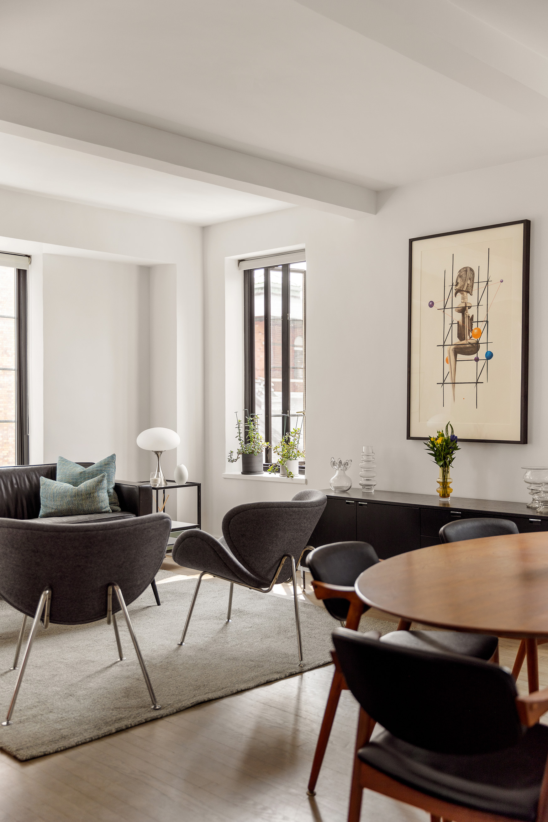 201 West 16th Street, Unit 9A Manhattan, NY 10011 - Photo 2 of 14 a living room with furniture and a table