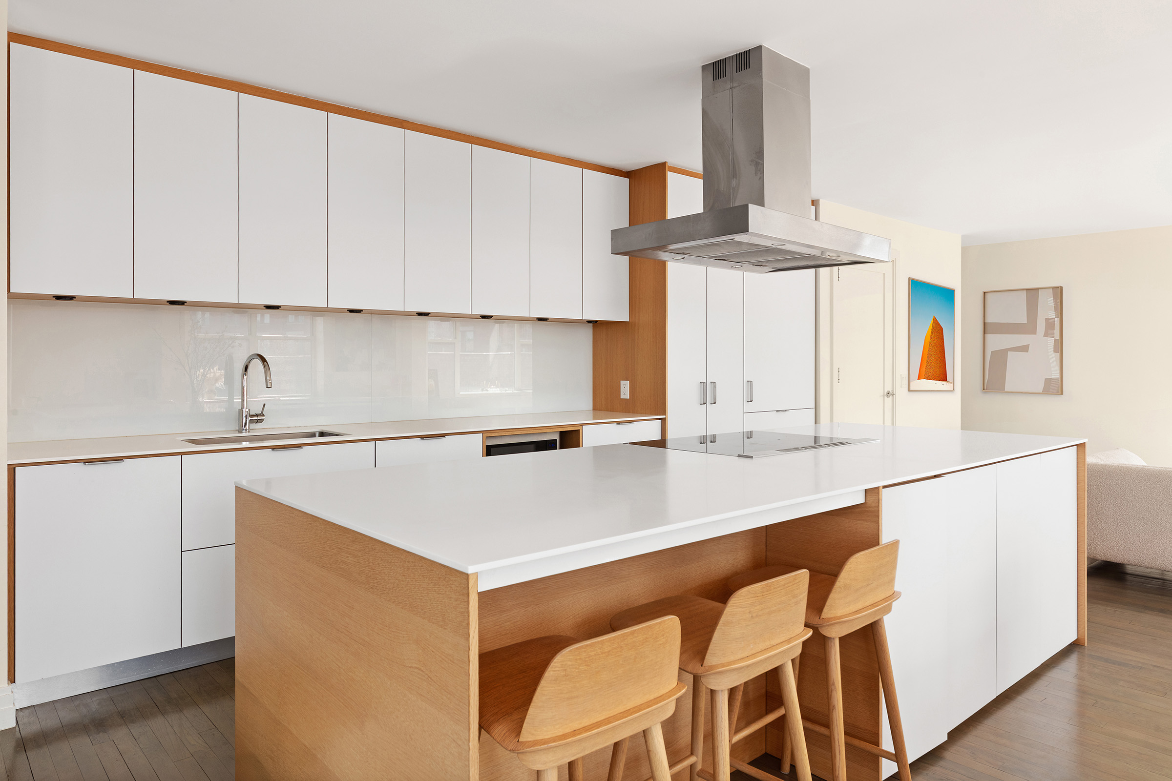 296 West 10th Street, Unit 8S Manhattan, NY 10014 - Photo 6 of 12 a kitchen with a sink cabinets and window