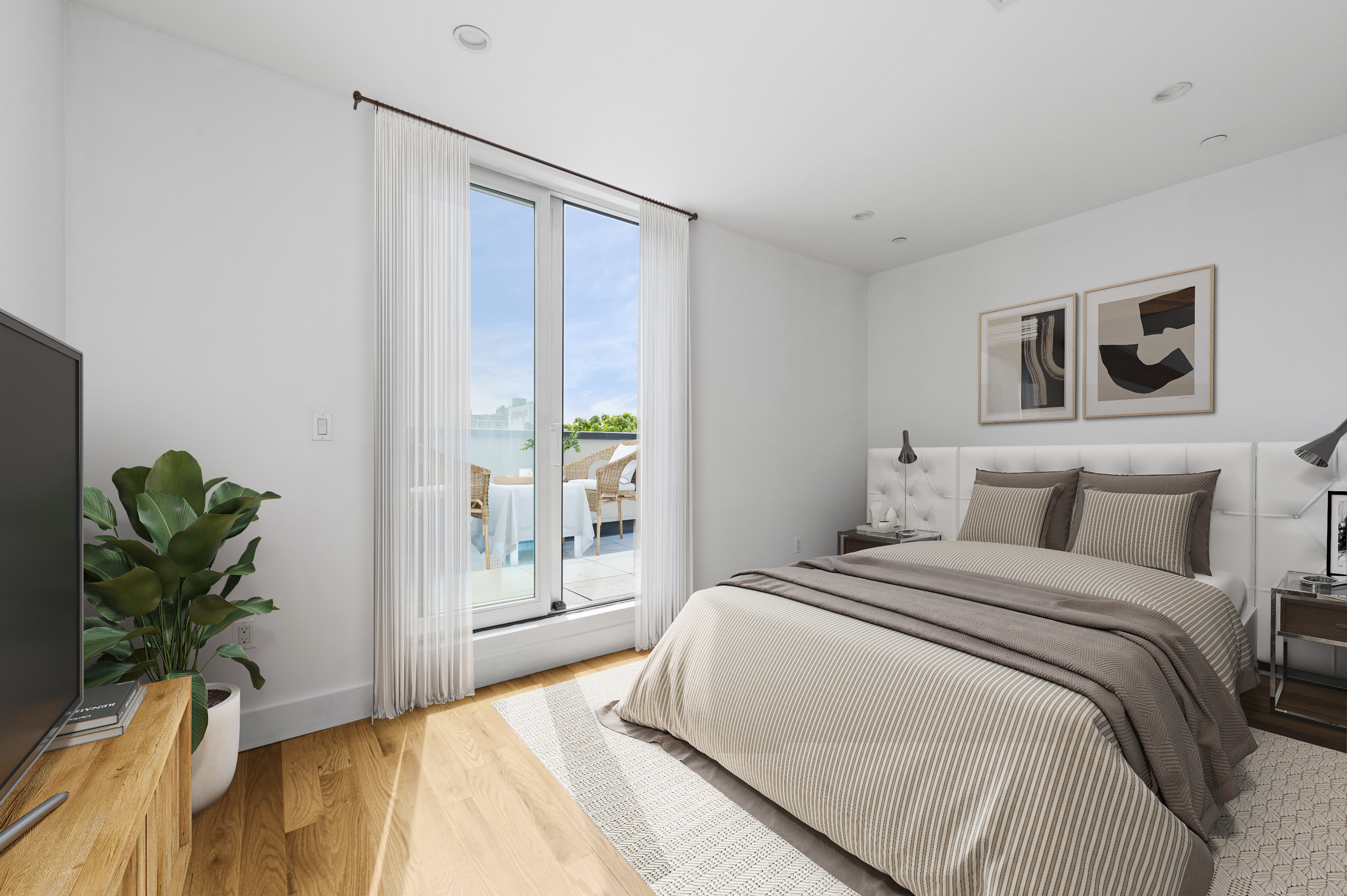 18 A Bleecker Street, Unit 4BD Brooklyn, NY 11221 - Photo 4 of 9 a bedroom with a large bed and a potted plant