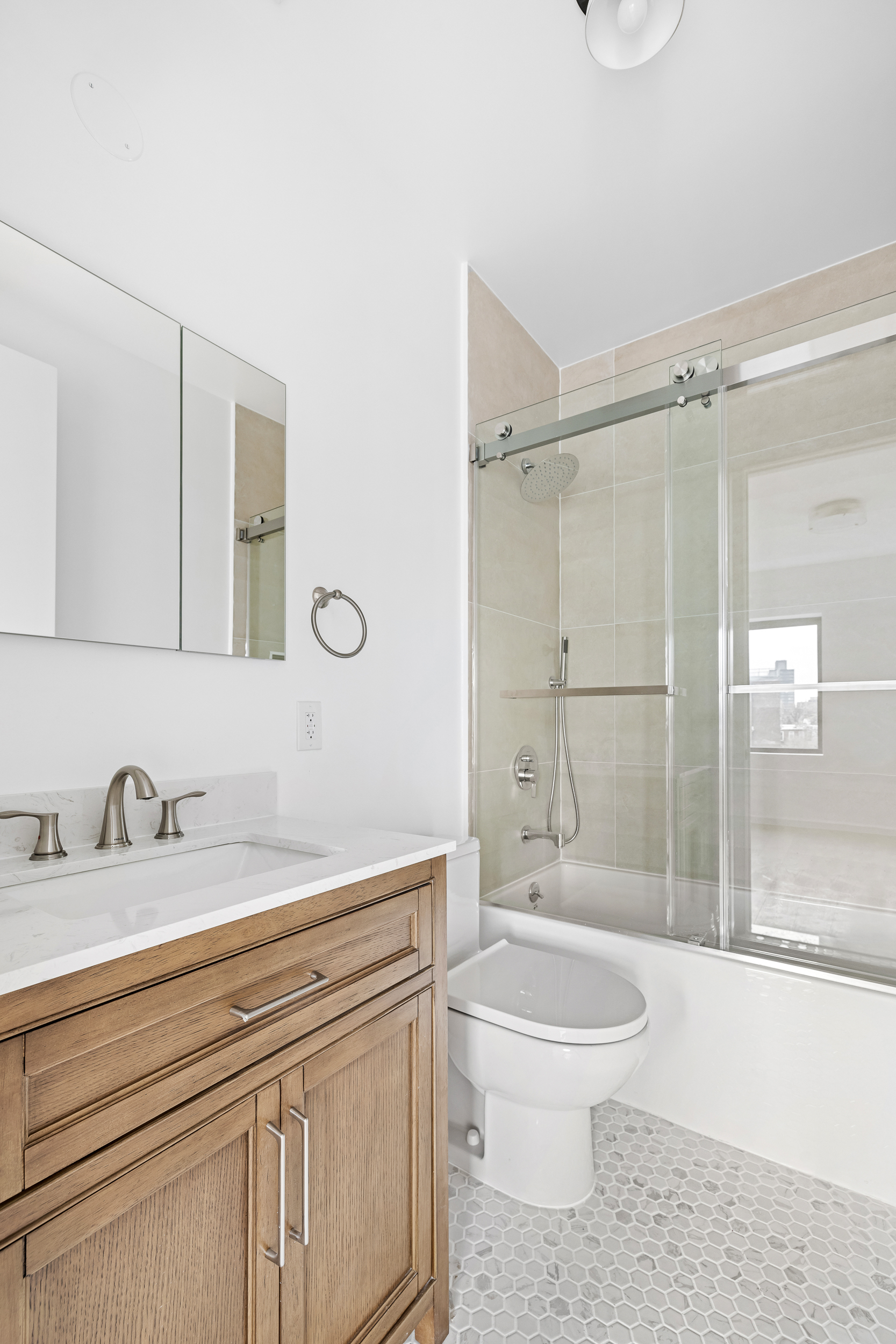 317 Court Street, Unit 3 Brooklyn, NY 11231 - Photo 10 of 15 a bathroom with a sink a toilet and shower