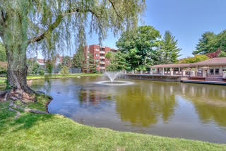 99 Florence Street Chestnut Hill, MA 02467 - Photo 2 of 2 a view of a lake with houses in the back