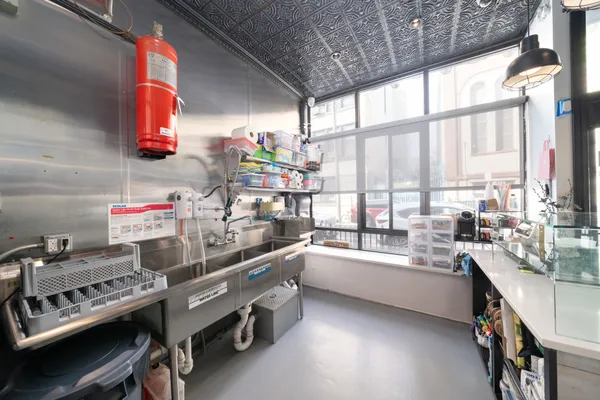 a kitchen with a sink stove and window