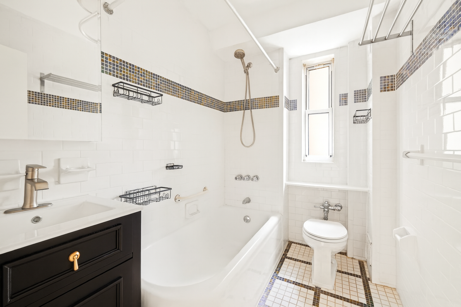 181 73rd Street, Unit 451 Brooklyn, NY 11209 - Photo 10 of 12 a bathroom with a sink a toilet and shower