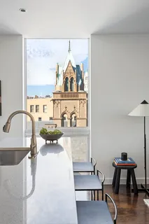 a view of a kitchen with dining table and chairs