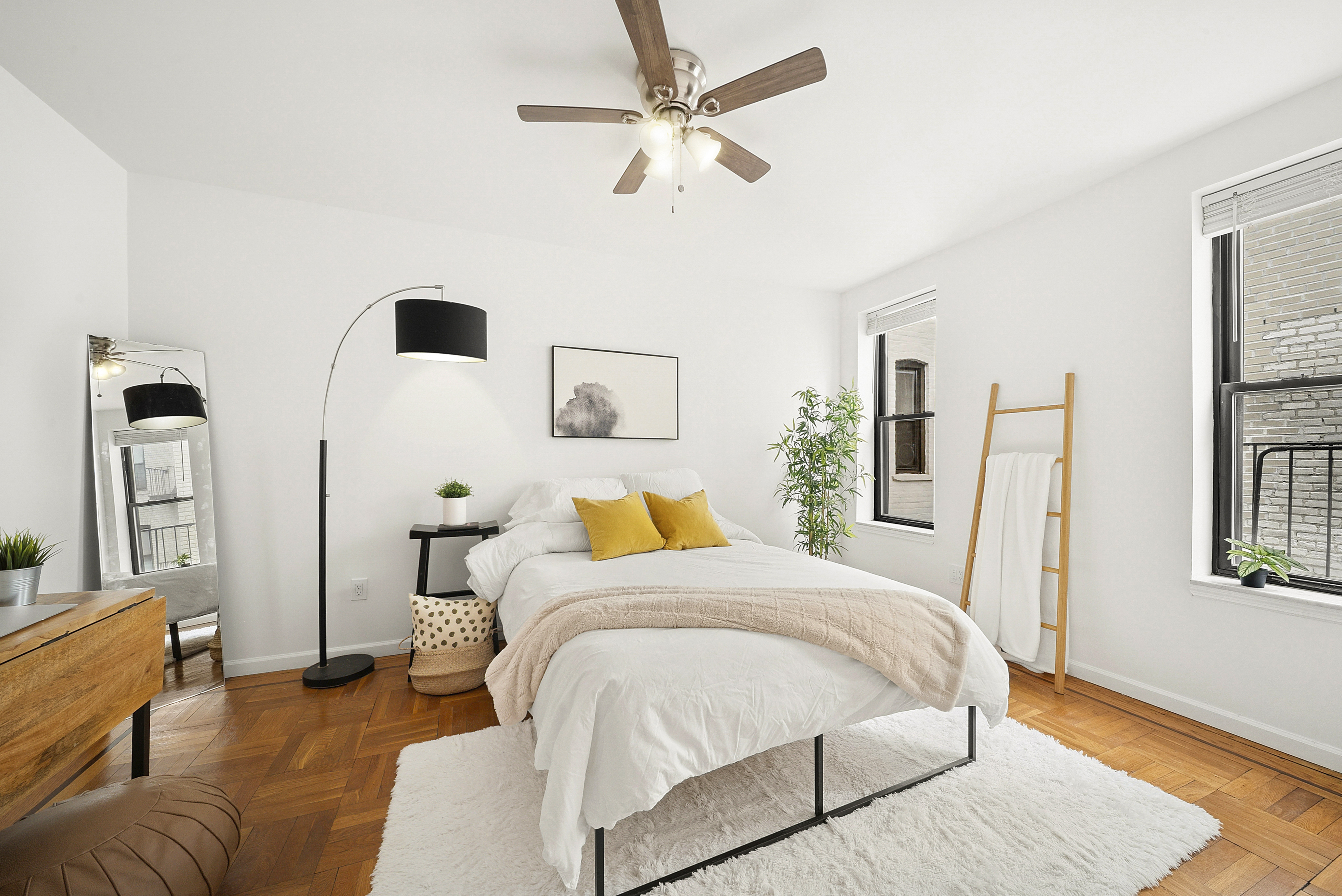 325 Marine Avenue, Unit D10 Brooklyn, NY 11209 - Photo 3 of 5 a bedroom with a bed a couch and a window