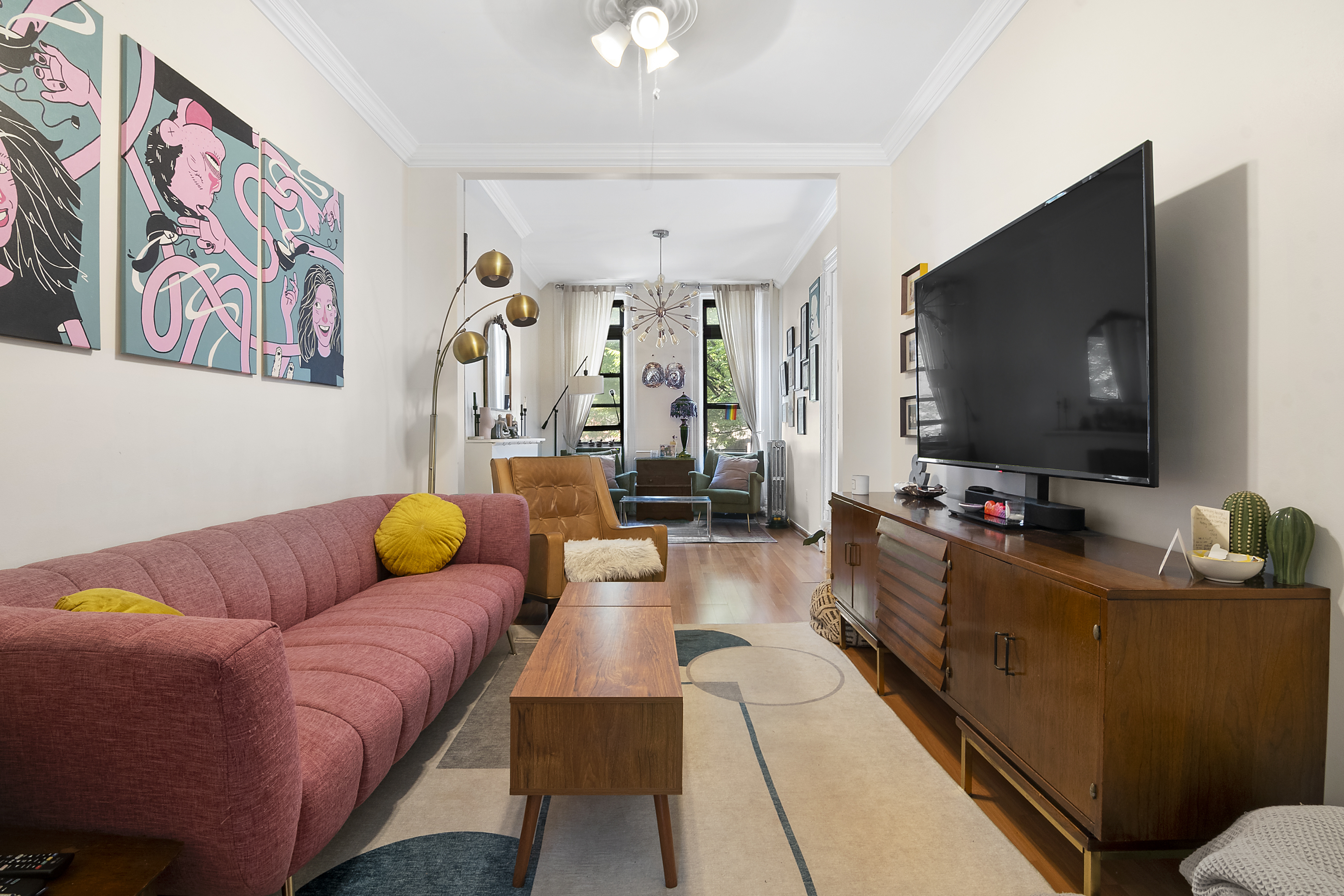 656 Union Street, Unit 2 Brooklyn, NY 11215 - Photo 3 of 12 a living room with furniture and a flat screen tv