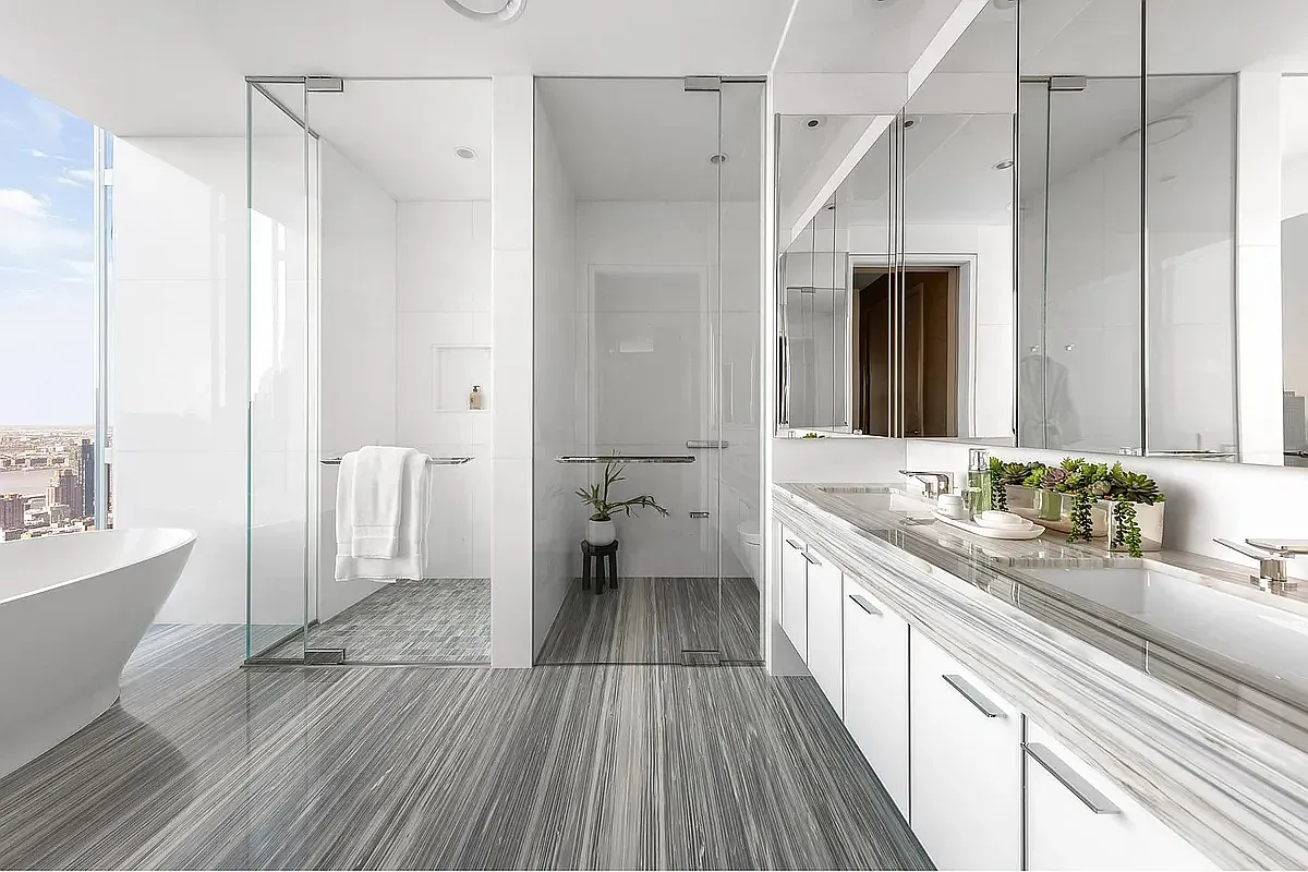 a spacious bathroom with a double vanity sink and a large mirror