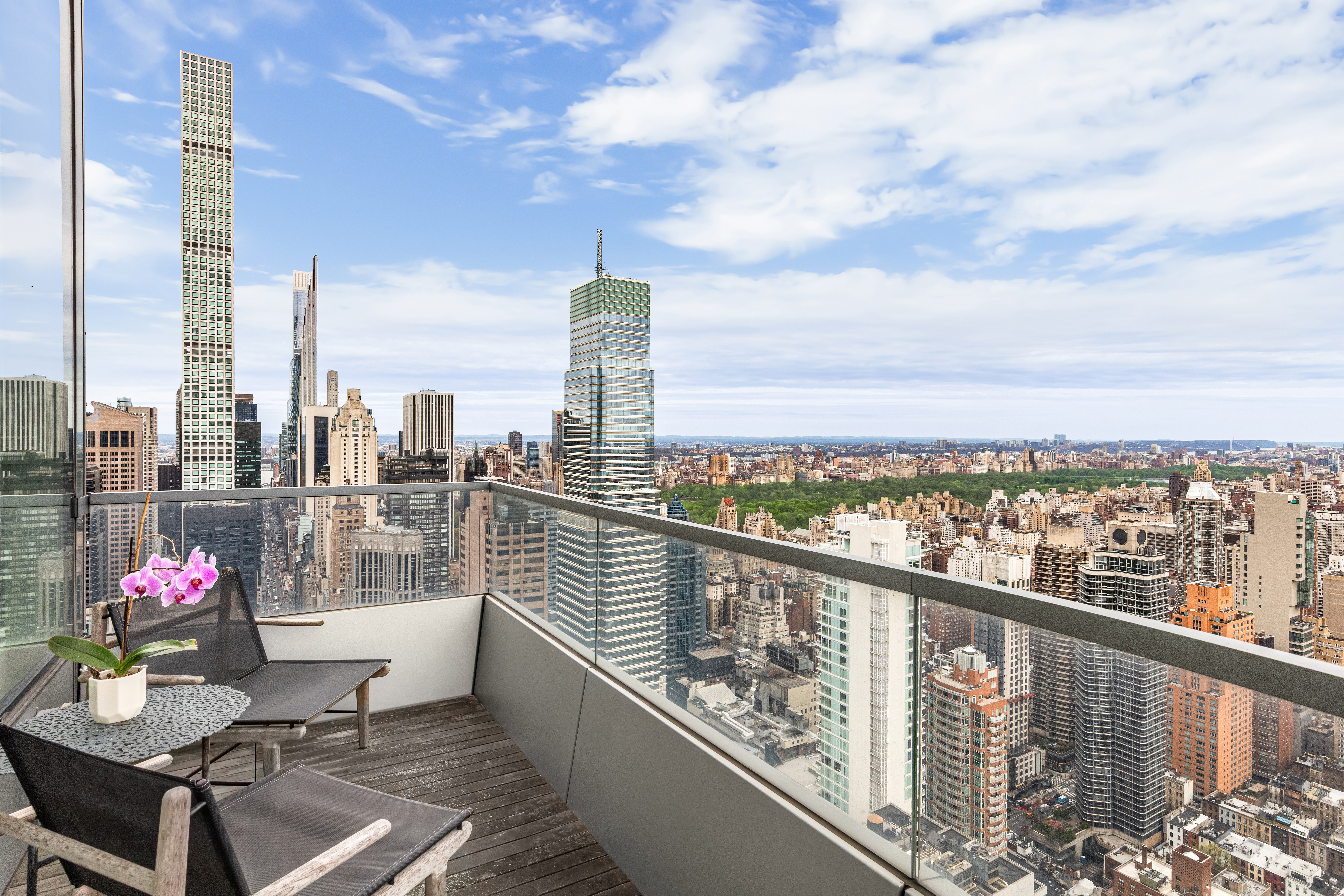 252 East 57th Street, Unit 60A Manhattan, NY 10022 - Photo 5 of 28 a view of a balcony with wooden benches