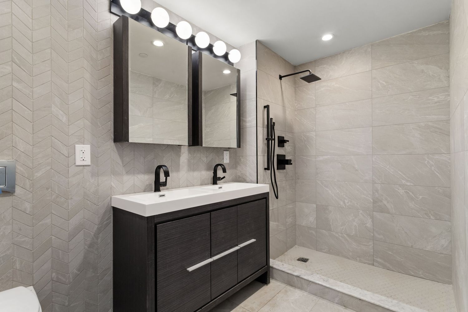 717 Manhattan Avenue, Unit 2A Brooklyn, NY 11222 - Photo 6 of 17 a bathroom with a sink toilet a mirror and shower
