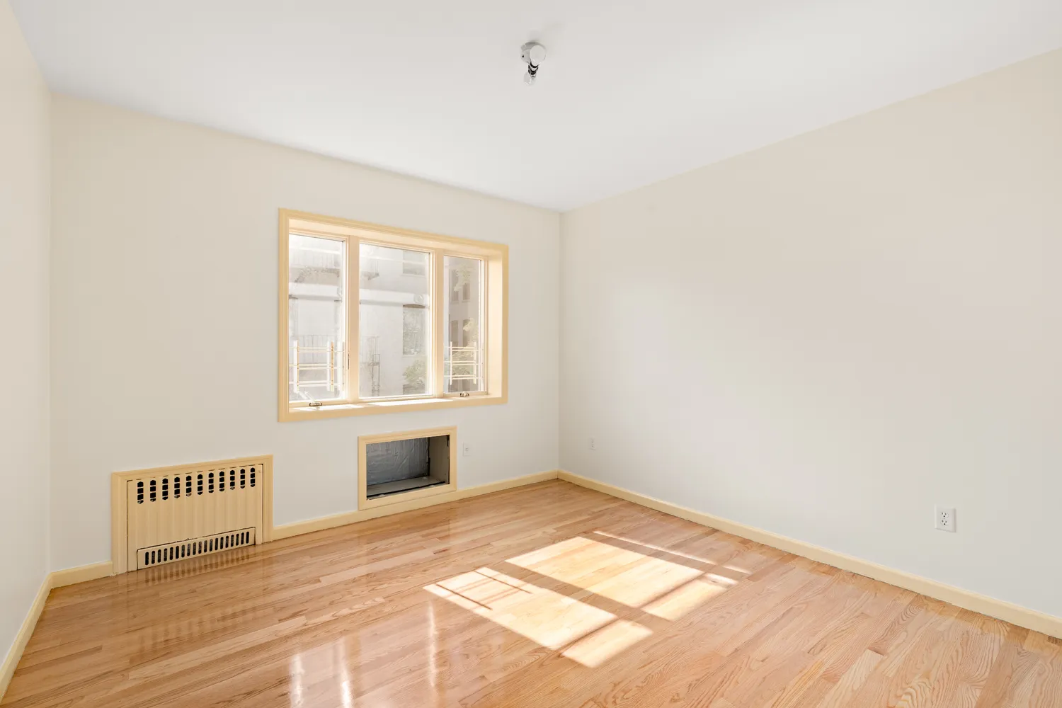 a view of an empty room and window