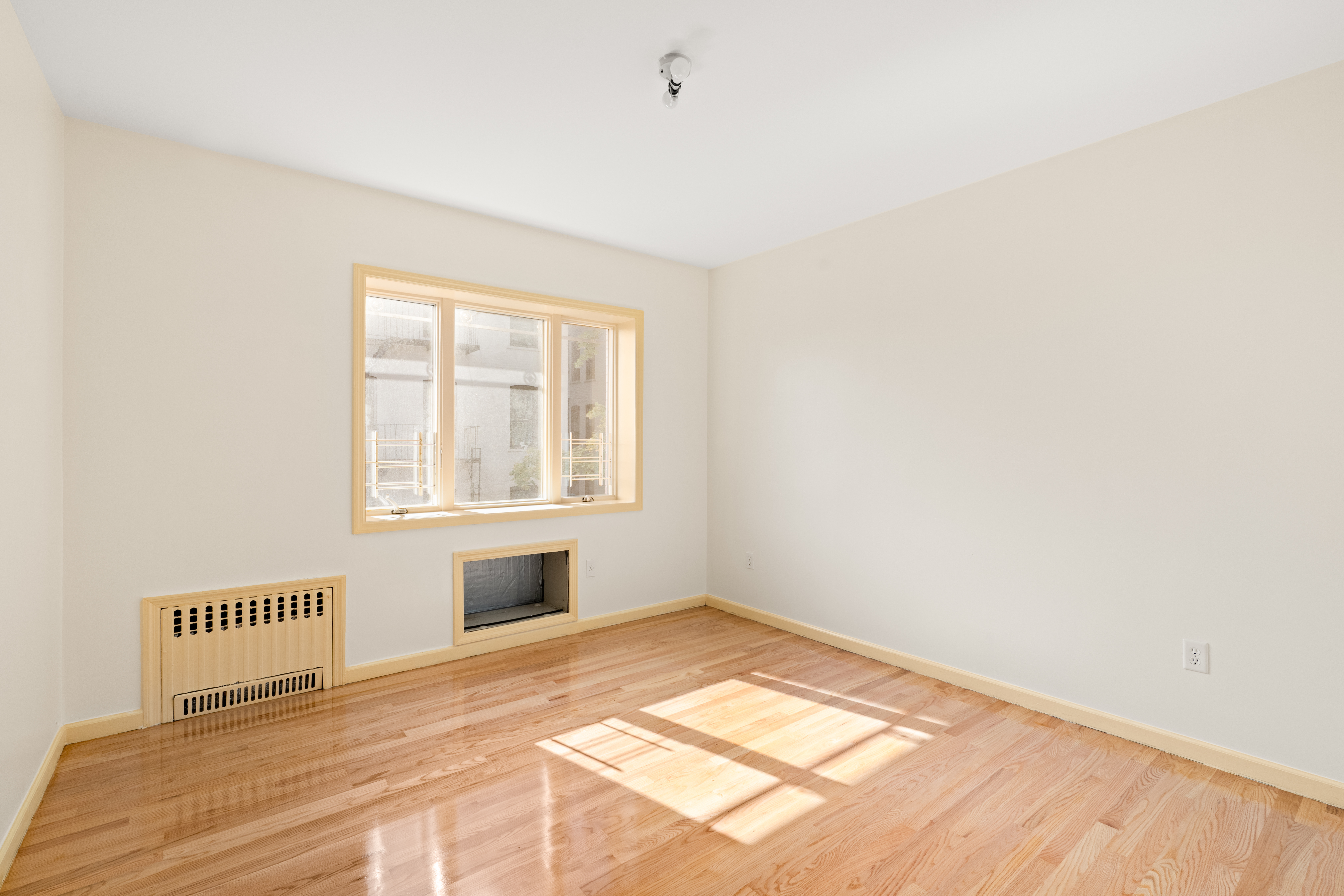 1920 83rd Street, Unit 3 Brooklyn, NY 11214 - Photo 4 of 9 a view of an empty room and window