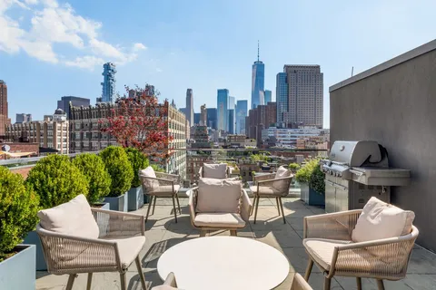 a view of a terrace with furniture and a potted plant