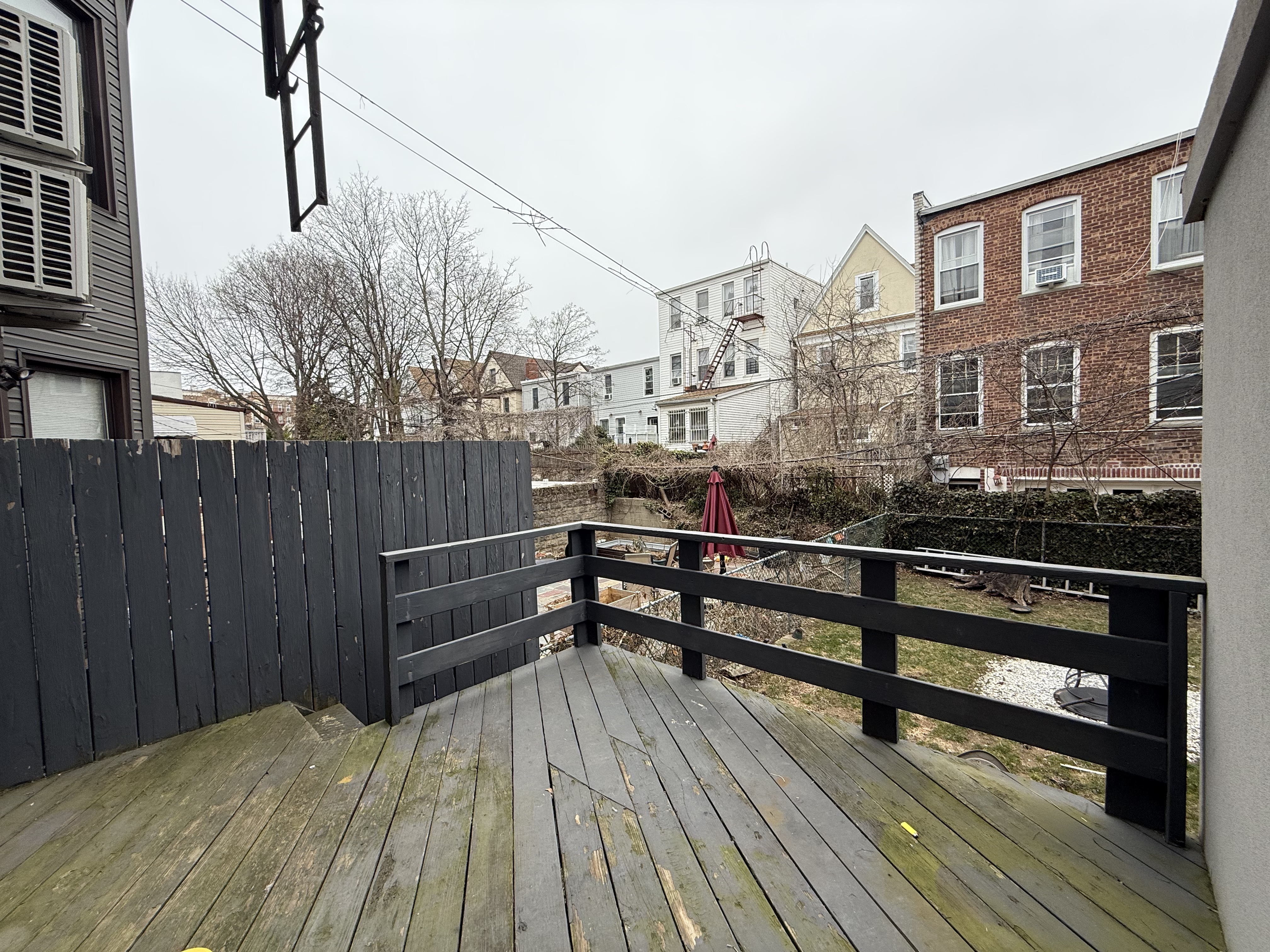 249 94th Street, Unit 1 Brooklyn, NY 11209 - Photo 12 of 13 a view of a roof deck with wooden floor and bench