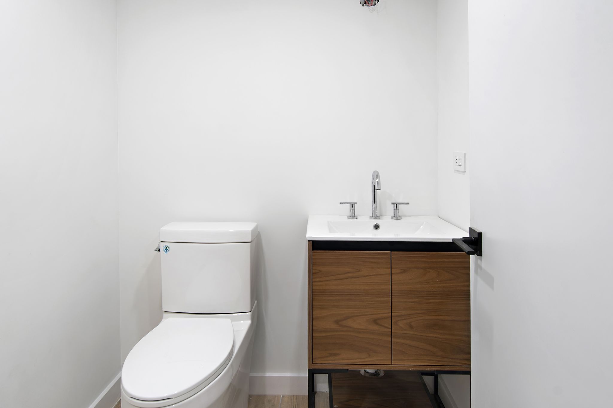 181 Kosciuszko Street Brooklyn, NY 11216 - Photo 19 of 20 a bathroom with a toilet a sink and mirror