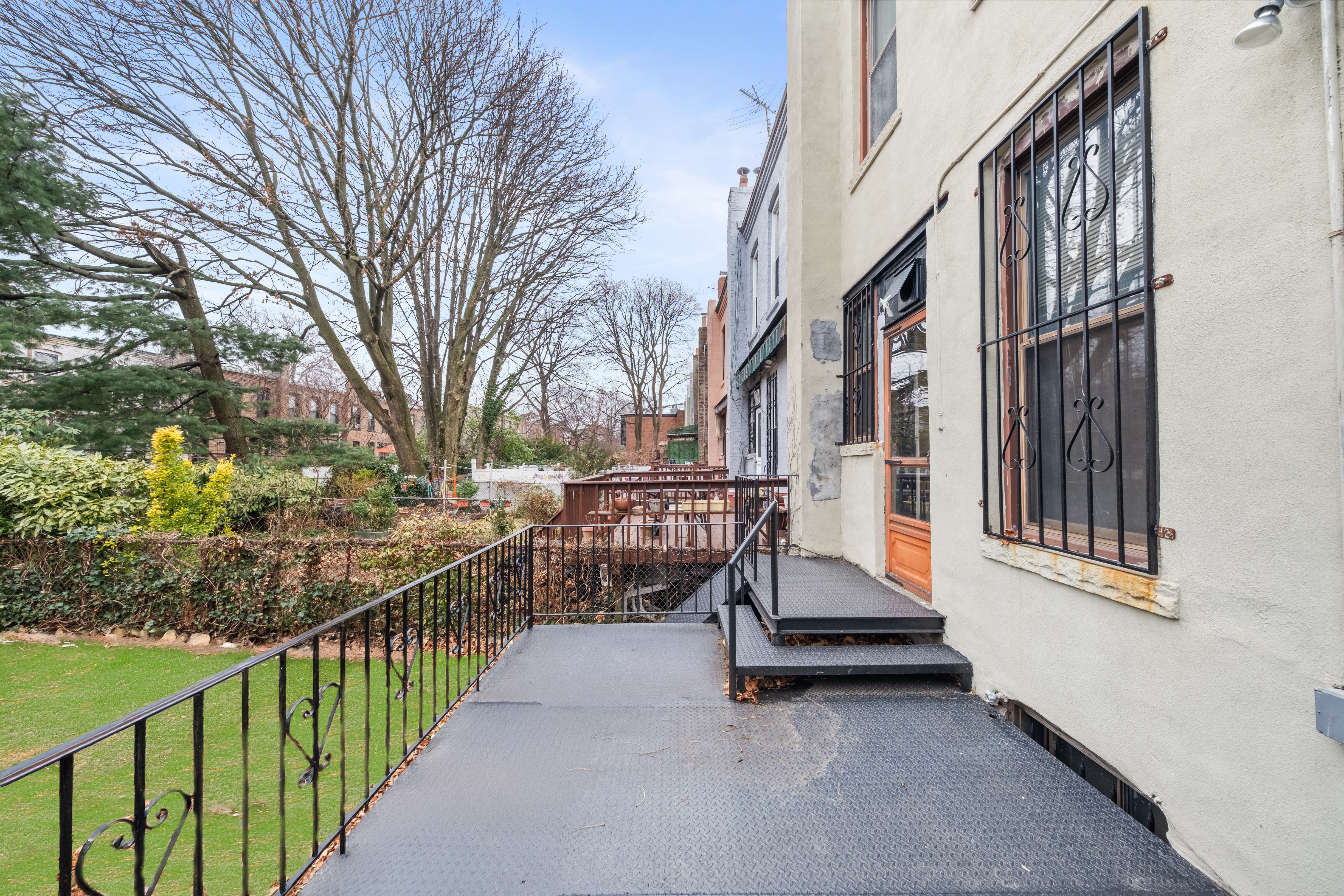 196 Maple Street Brooklyn, NY 11225 - Photo 23 of 31 a view of a house with a back yard