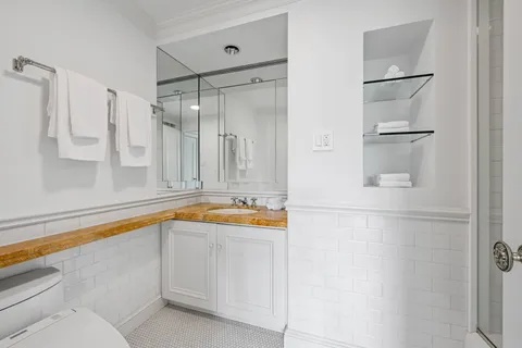 a view of kitchen island with sink