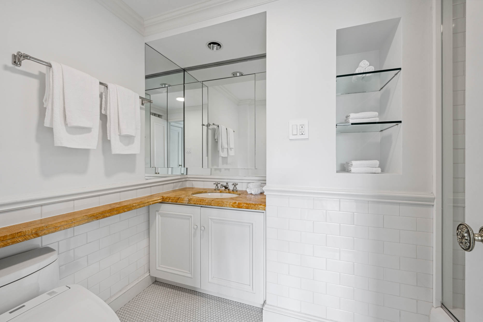 936 5th Avenue, Unit 10AB Manhattan, NY 10021 - Photo 18 of 37 a bathroom with a tub and a shower