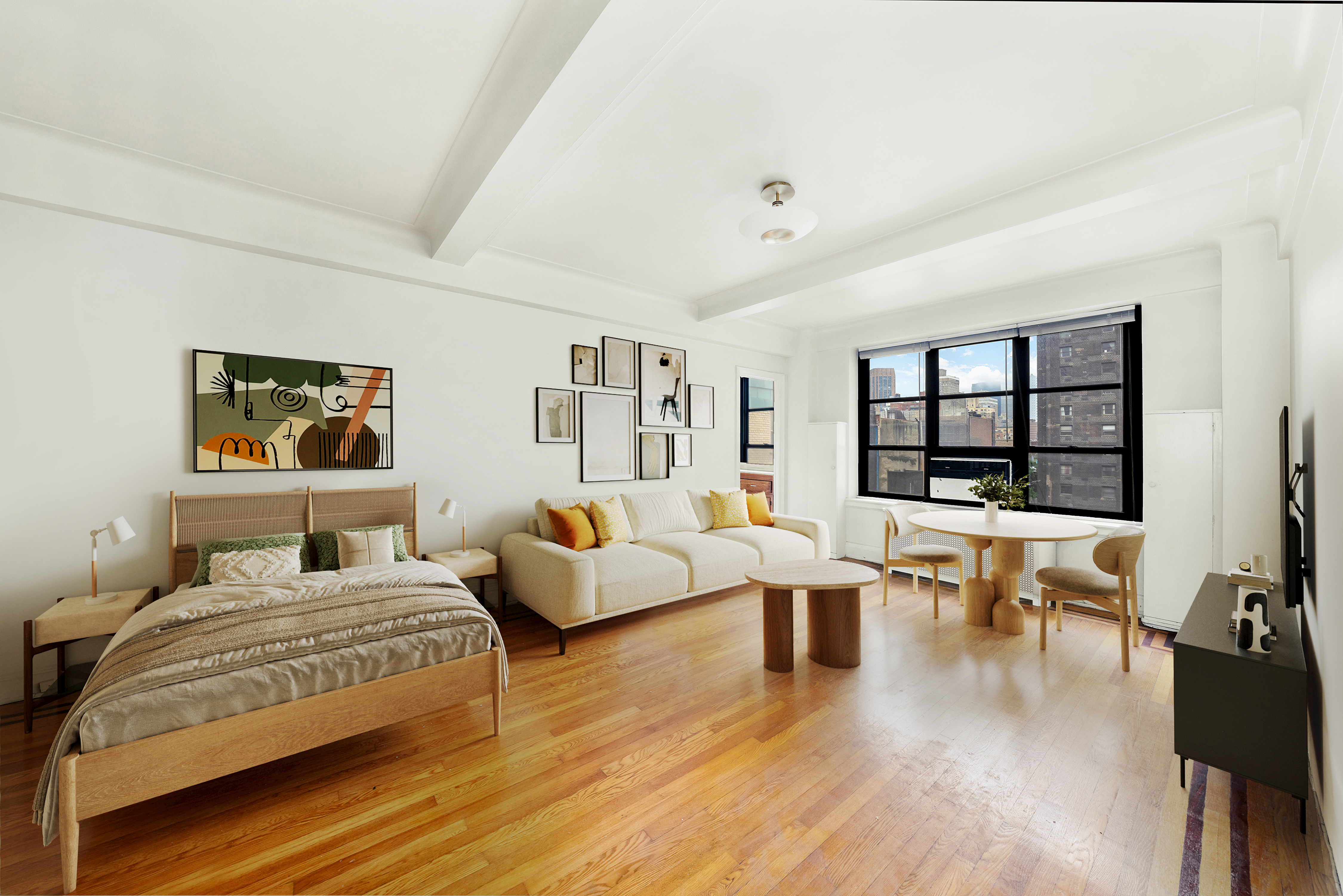 235 East 22nd Street, Unit 9M Manhattan, NY 10010 - Photo 1 of 15 a bedroom with a large bed and a couch