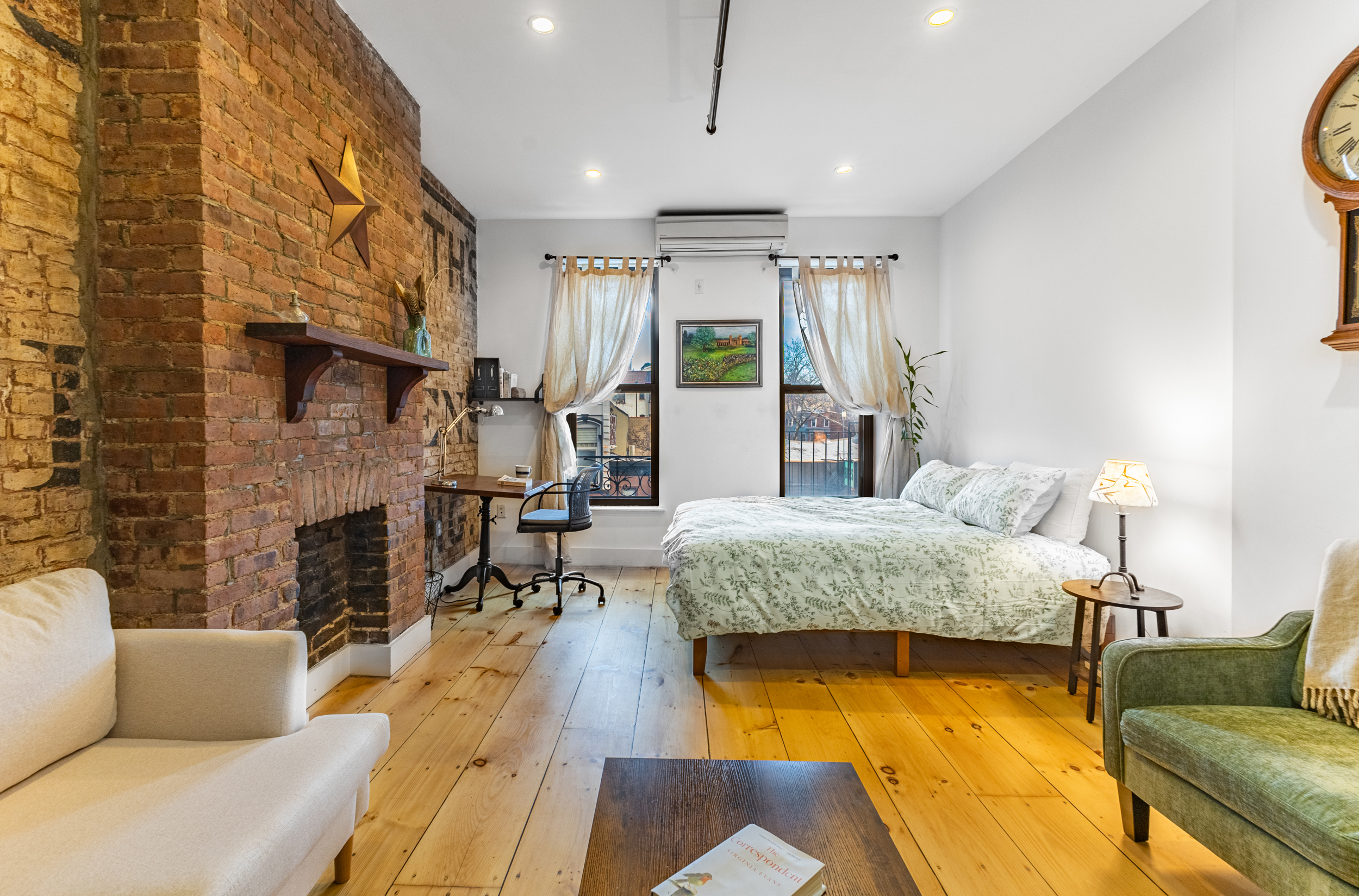 940 Fulton Street, Unit 3B Brooklyn, NY 11238 - Photo 2 of 18 a living room with furniture large window and a fireplace