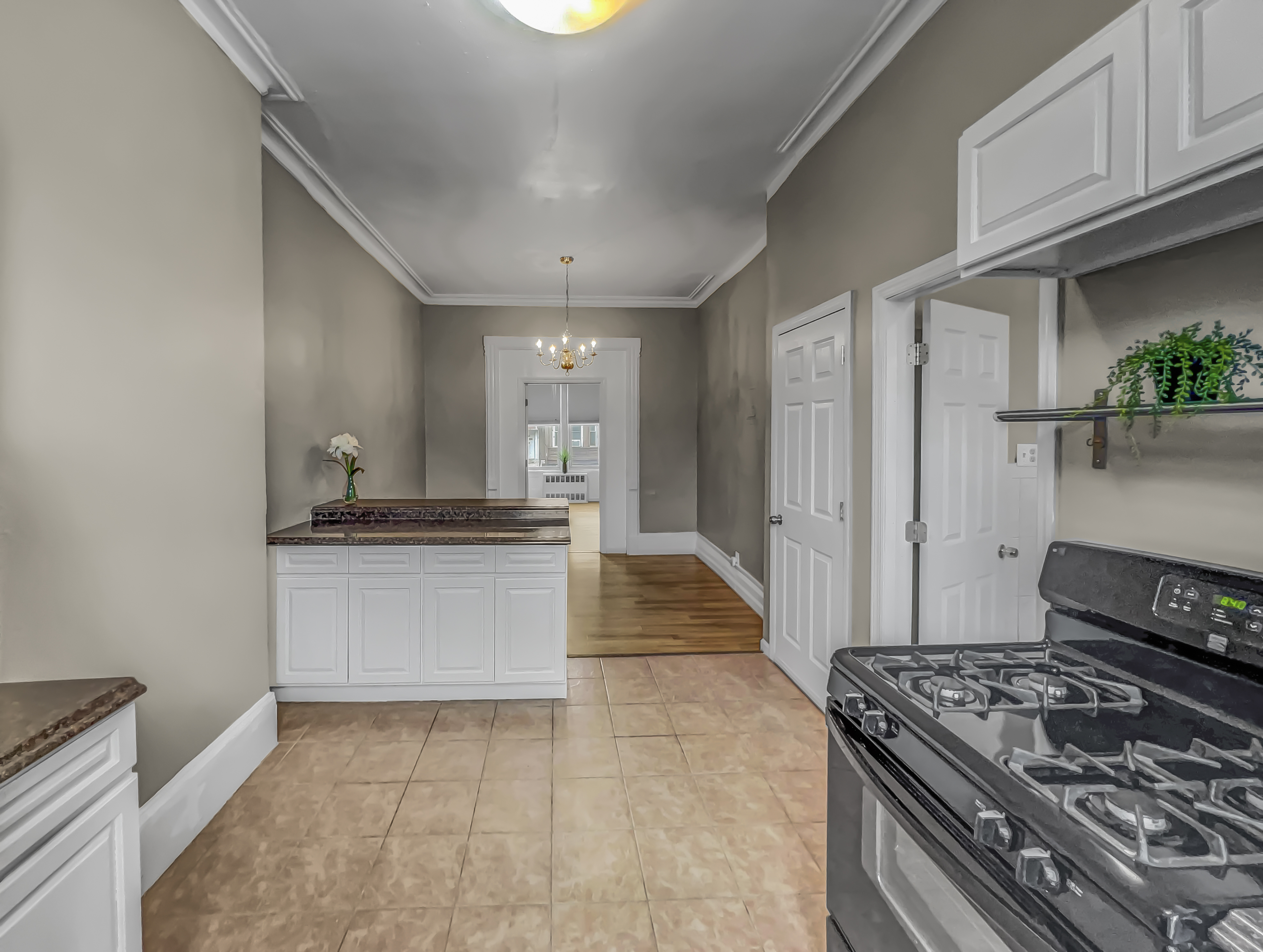 438 41st Street, Unit 2 Brooklyn, NY 11232 - Photo 3 of 8 a kitchen with stainless steel appliances granite countertop a stove and a refrigerator