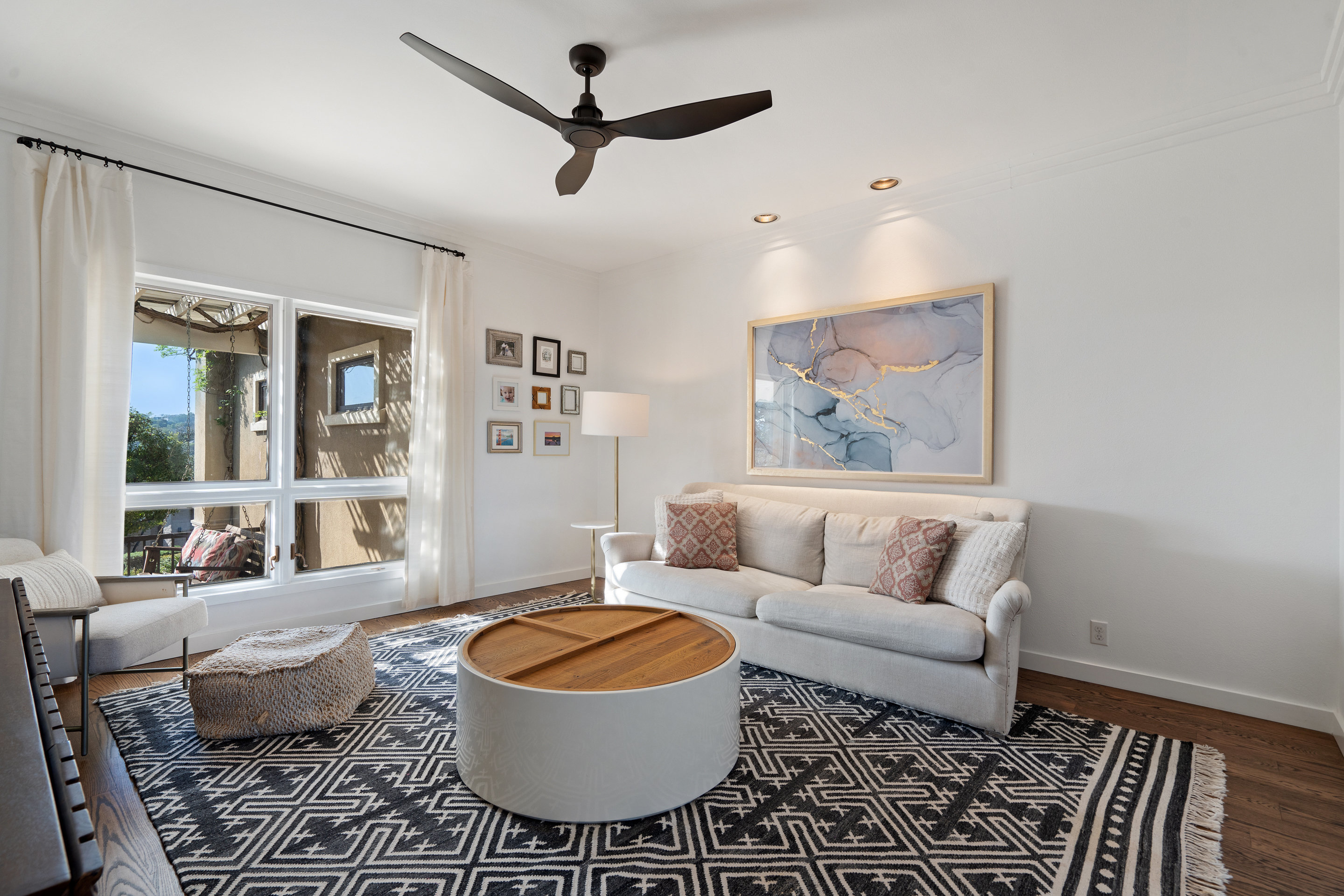 5319 Backtrail Drive Austin, TX 78731 - Photo 22 of 35 a living room with furniture and a rug