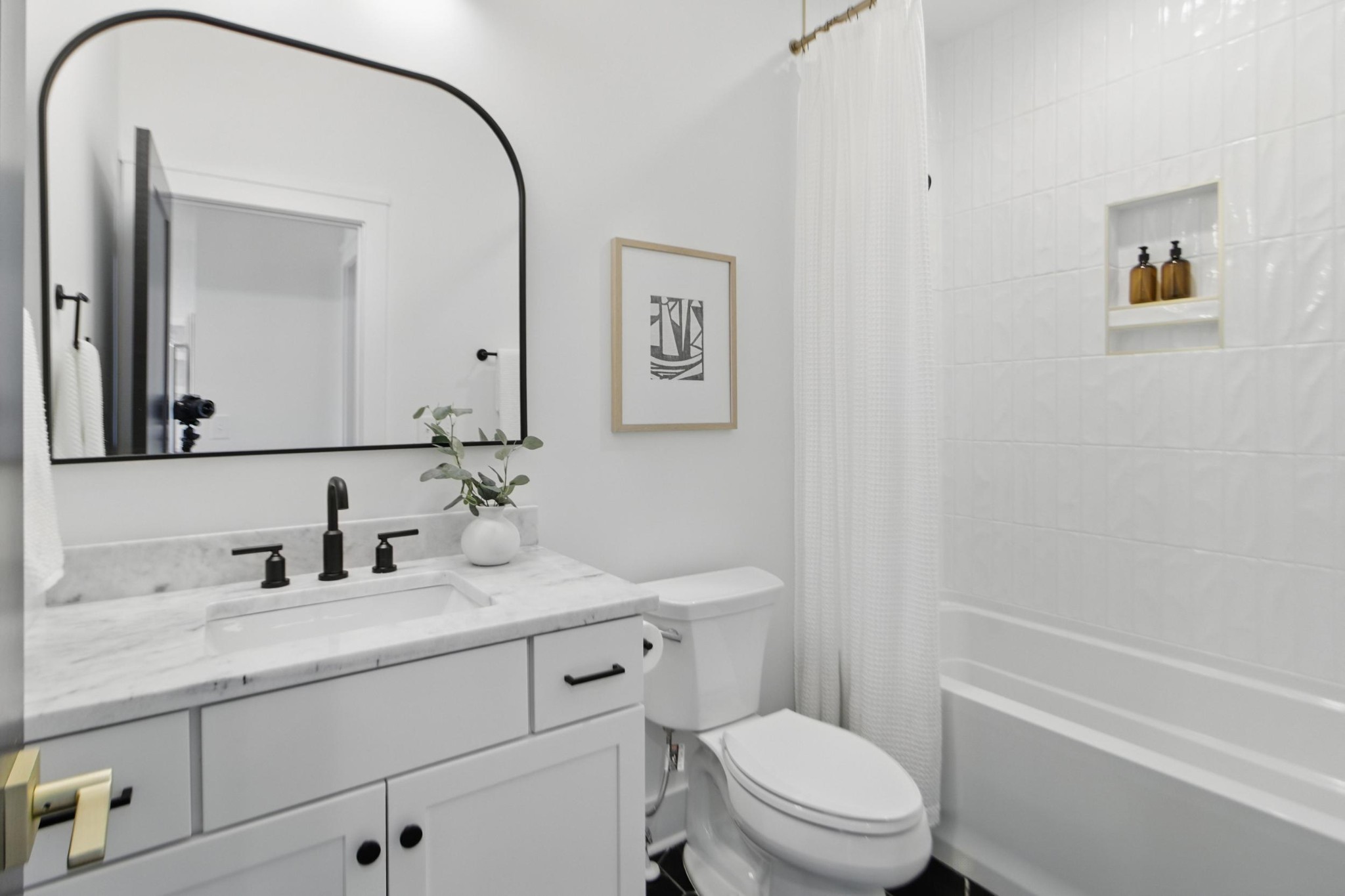 824 Watts Lane, Unit B Nashville, TN 37209 - Photo 10 of 23 a bathroom with a toilet a sink a mirror and a shower
