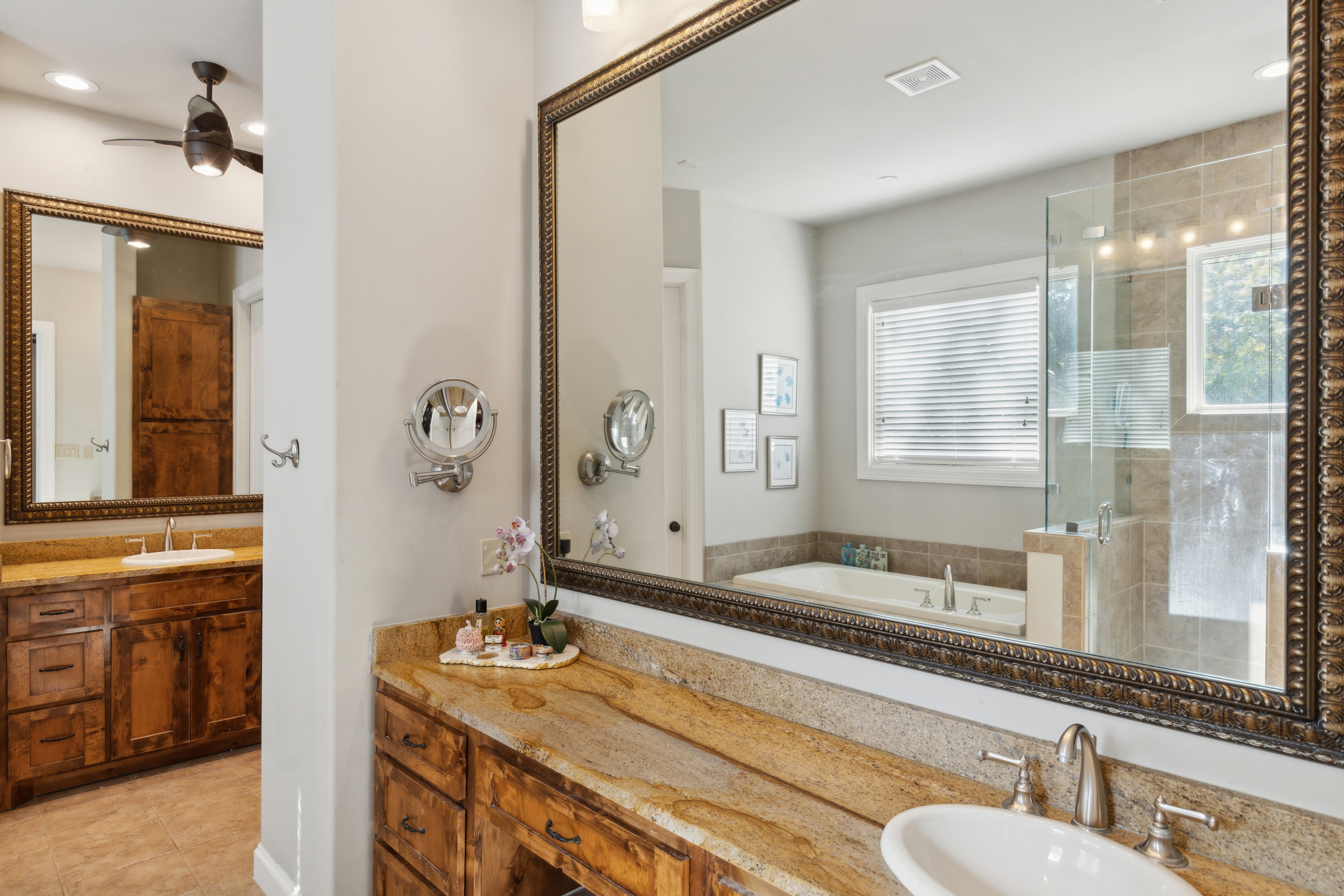 8411 Midway Road Dallas, TX 75209 - Photo 21 of 29 a bathroom with a granite countertop sink and a mirror
